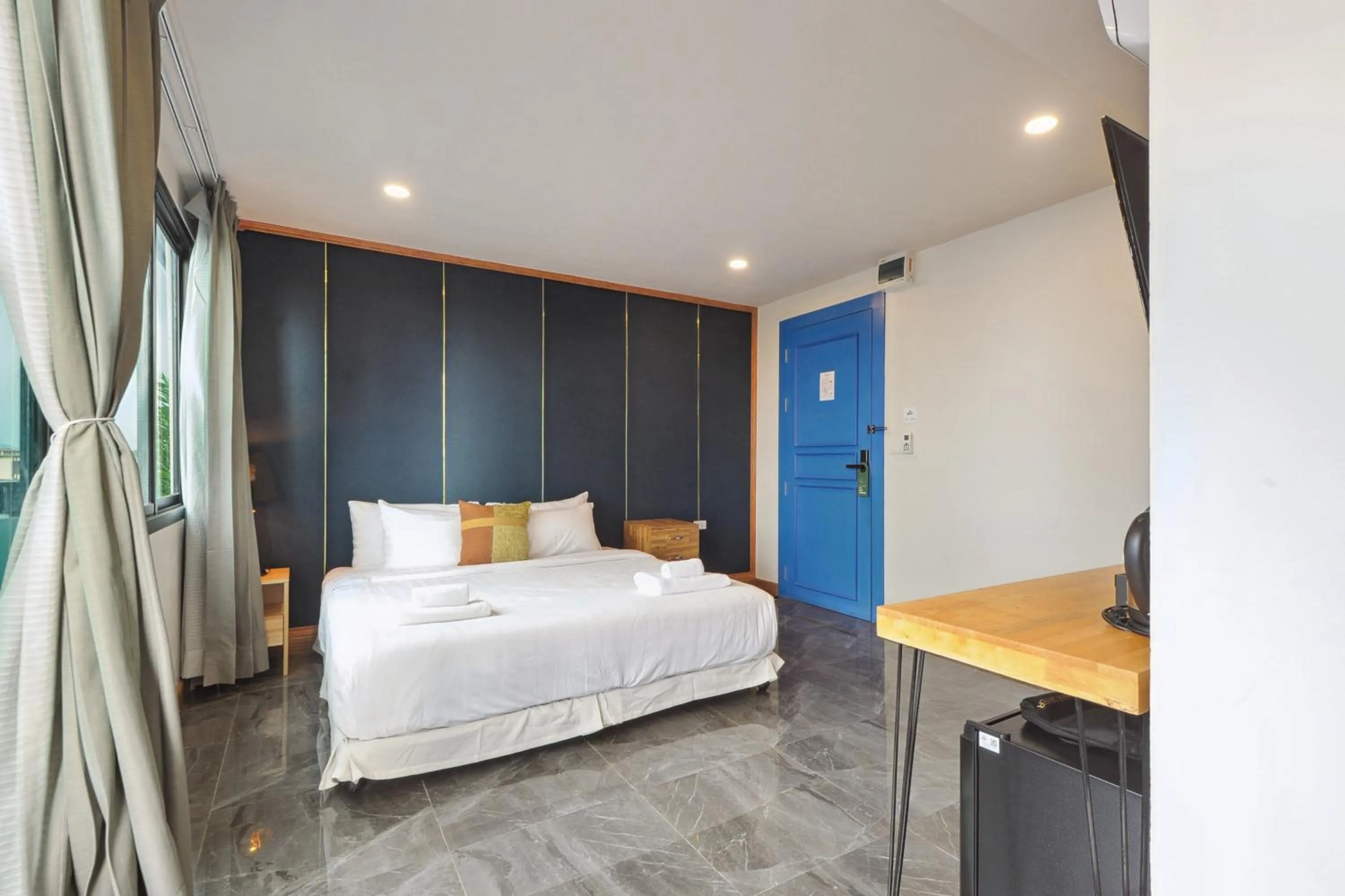 Photo of the whole room, Bed in Ployburi Boutique Hotel