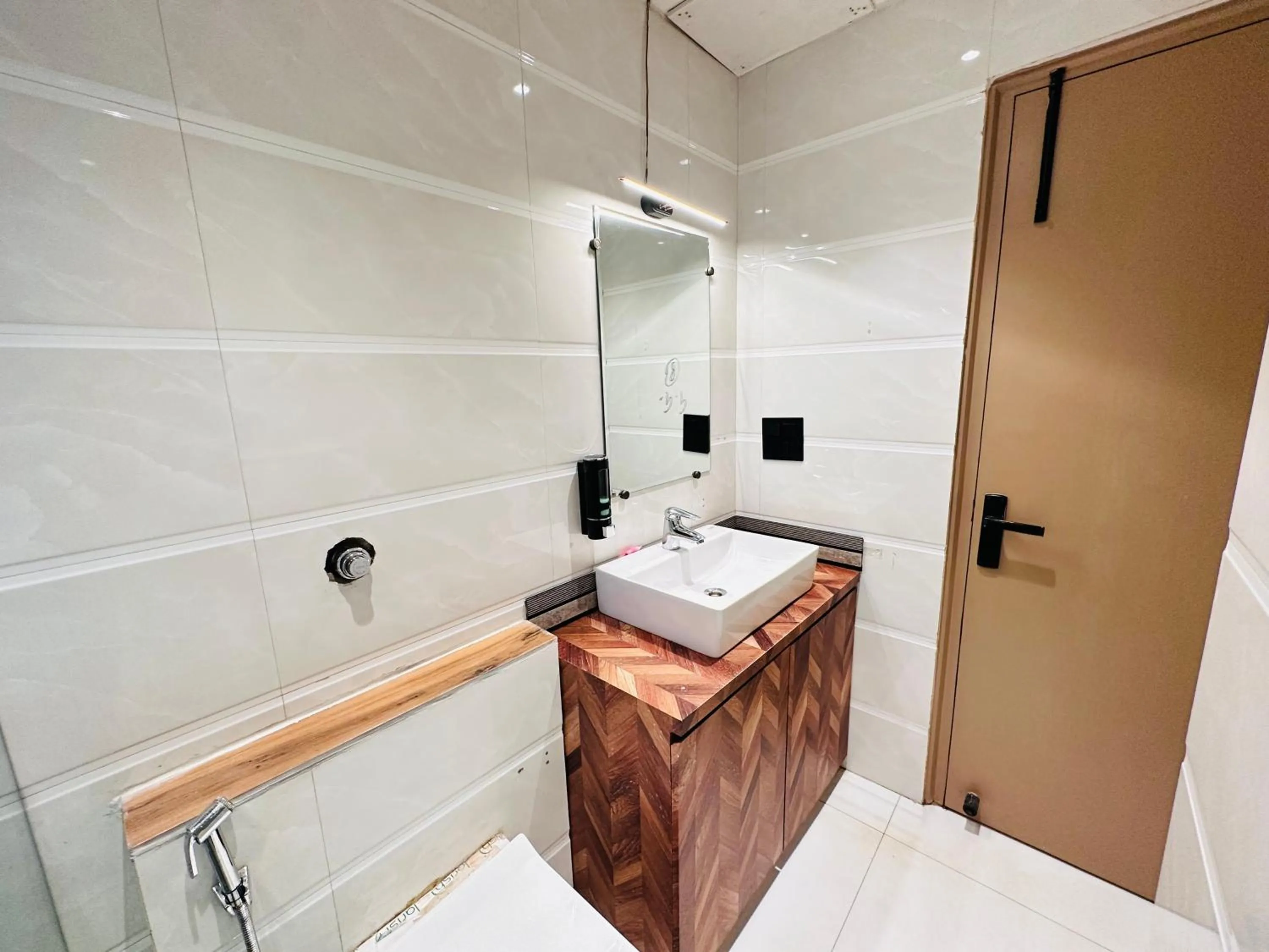 Bathroom in Hotel IP Swarn near Anand Vihar Vaishali Ghaziabad