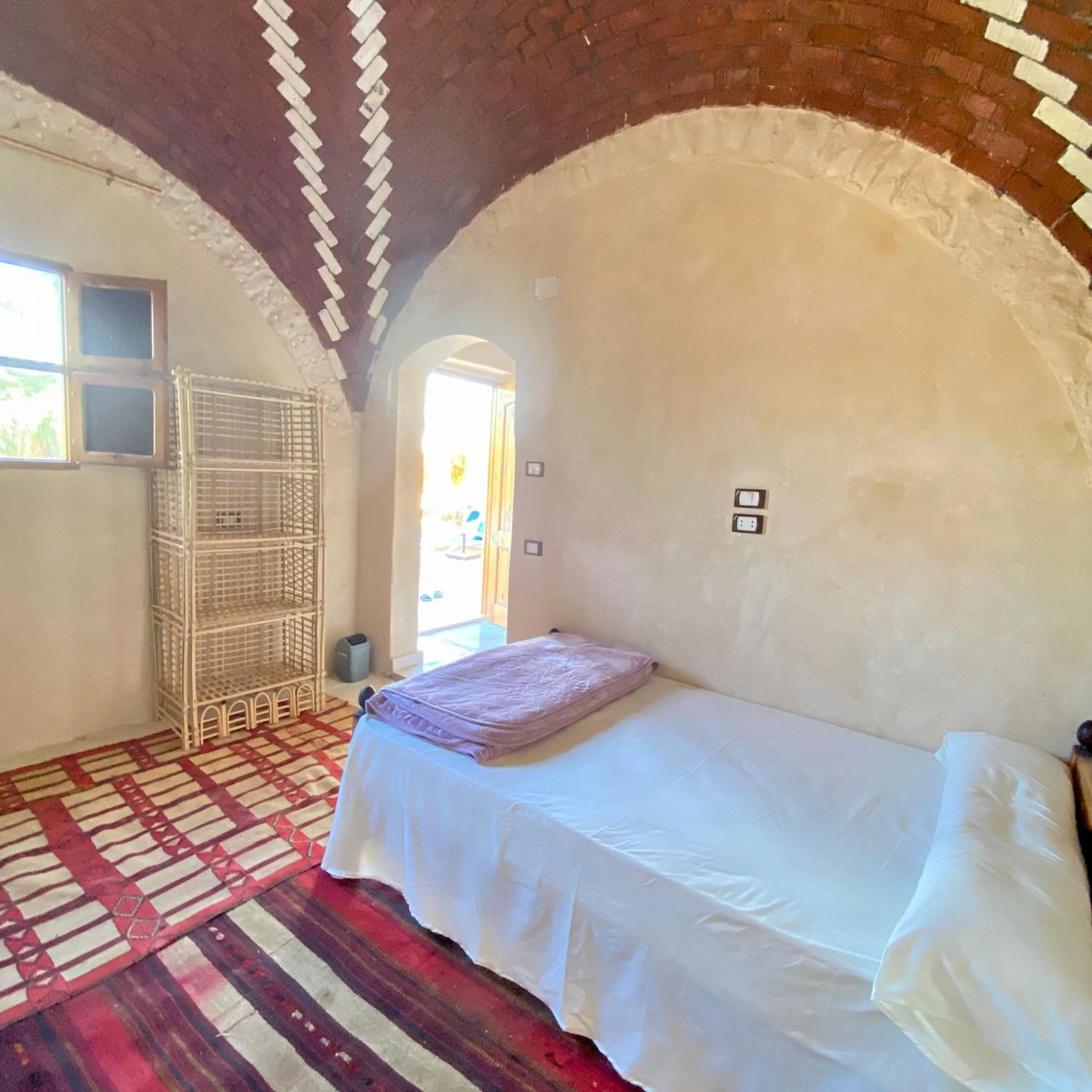 Bed in Siwa Palace Lodge
