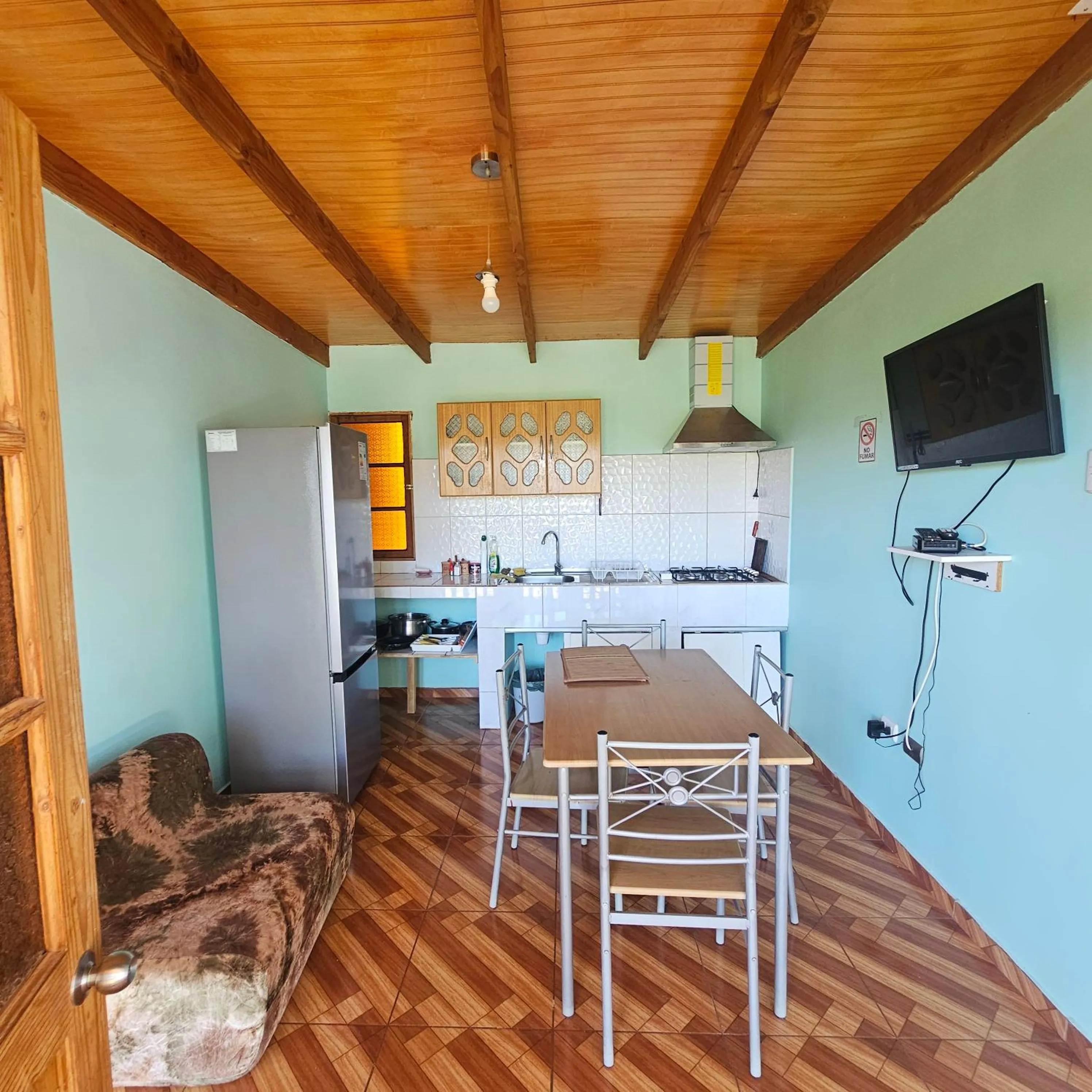 Communal lounge/ TV room in Hostal Casa los Duendes