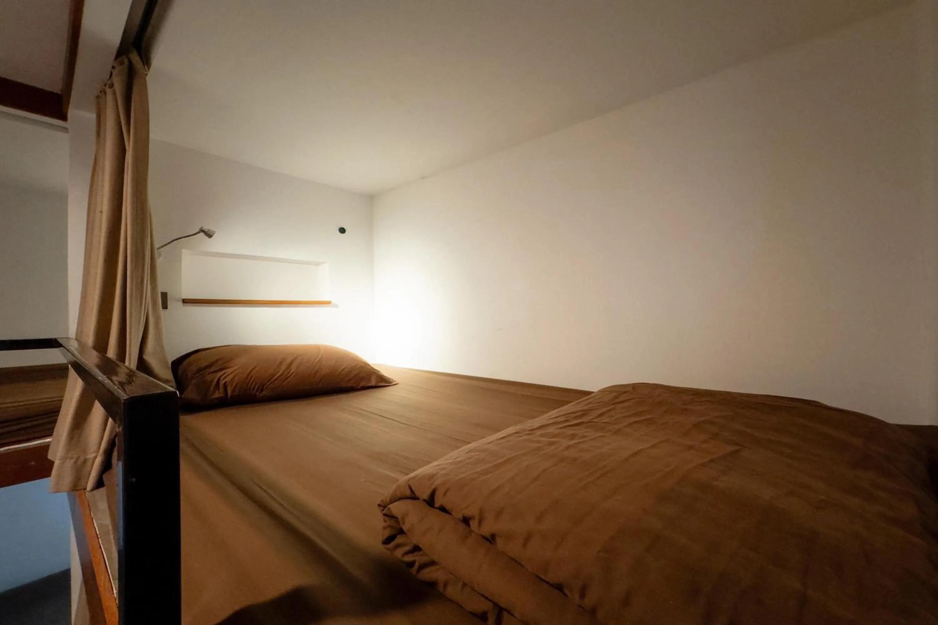 Bed in Once in a Blue Moon Cafe and Hostel