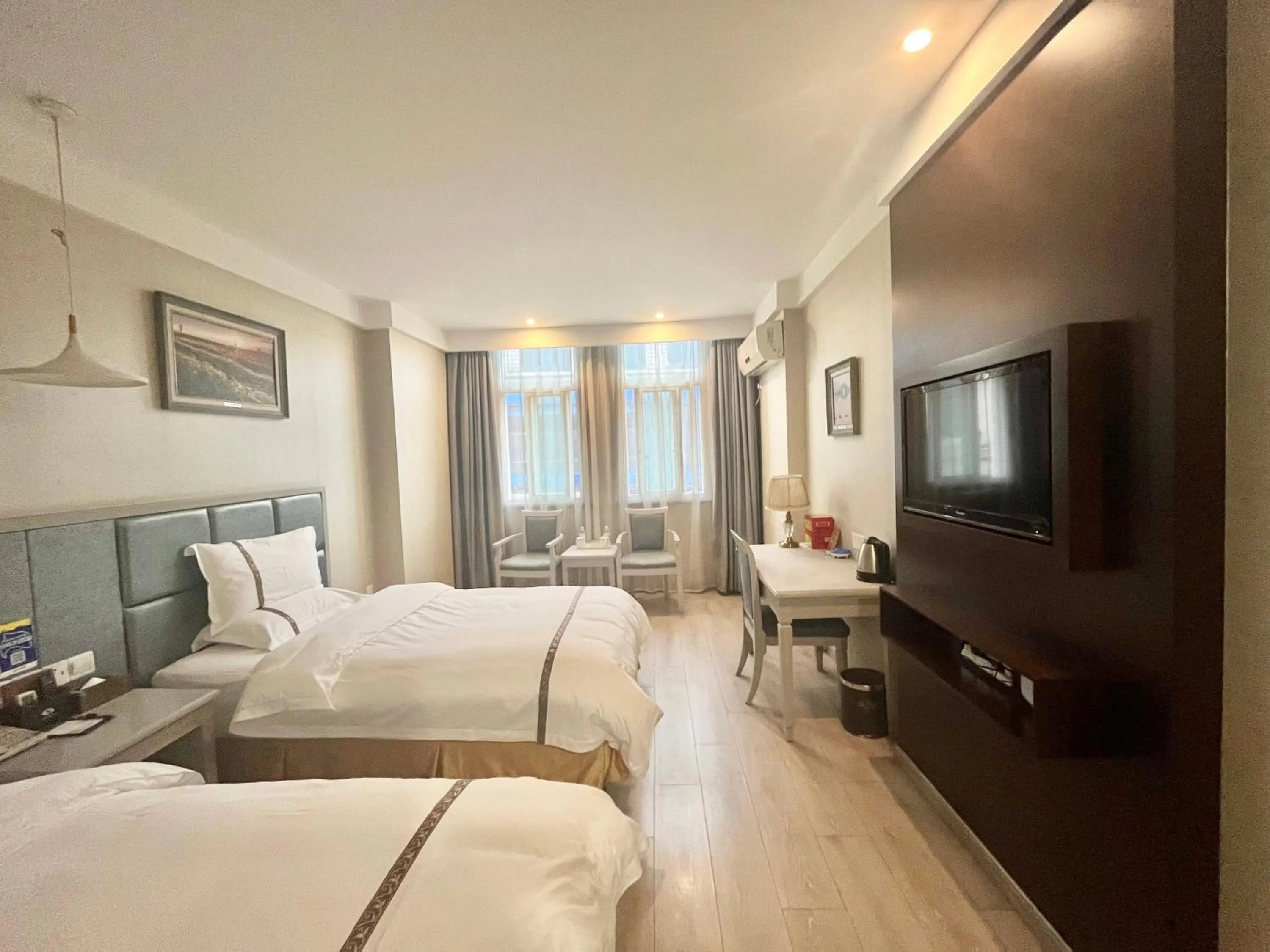 Communal lounge/ TV room, Bed in Tianshui Times Hotel Zhangjiagang