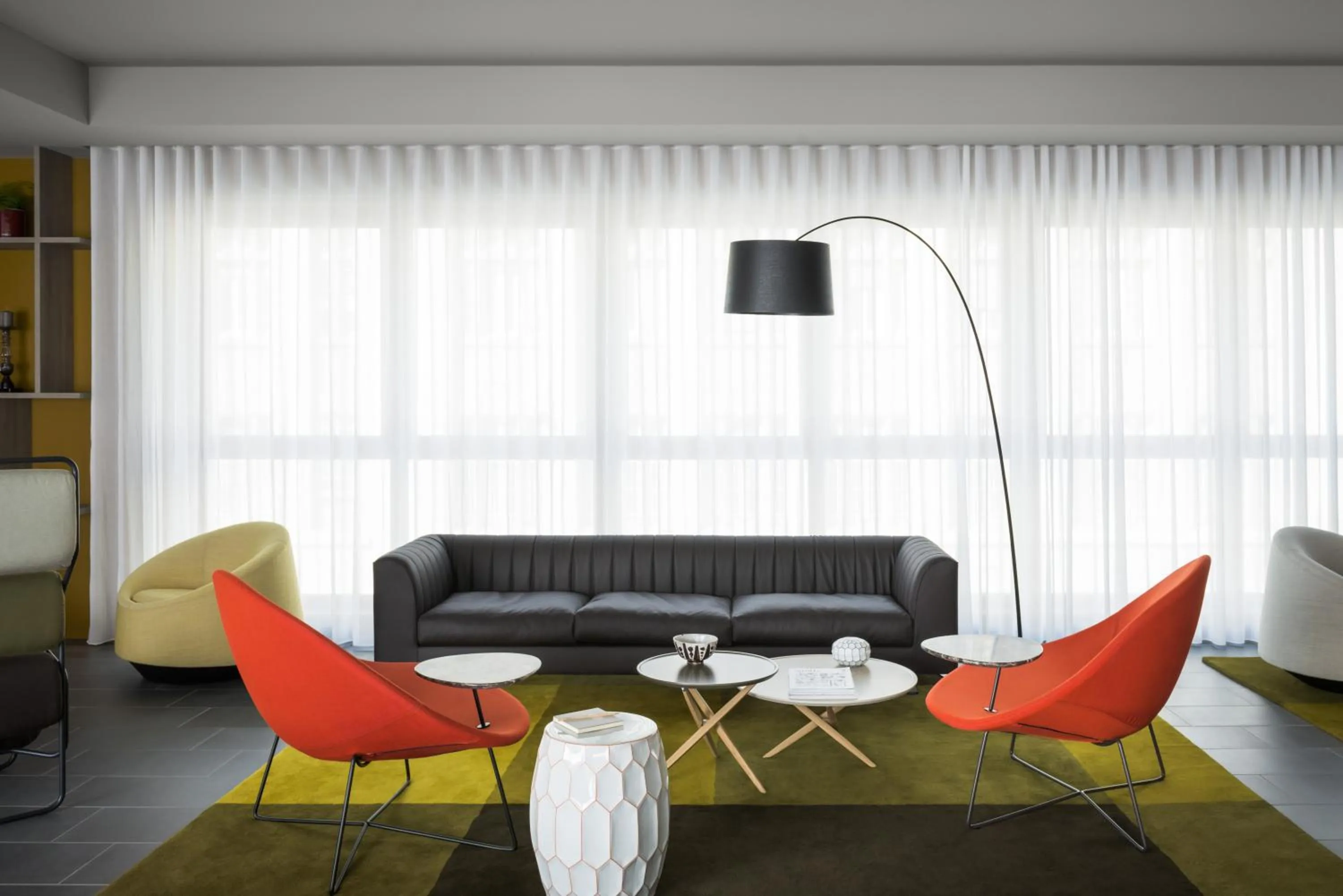 Communal lounge/ TV room in OKKO Hotels Grenoble Centre