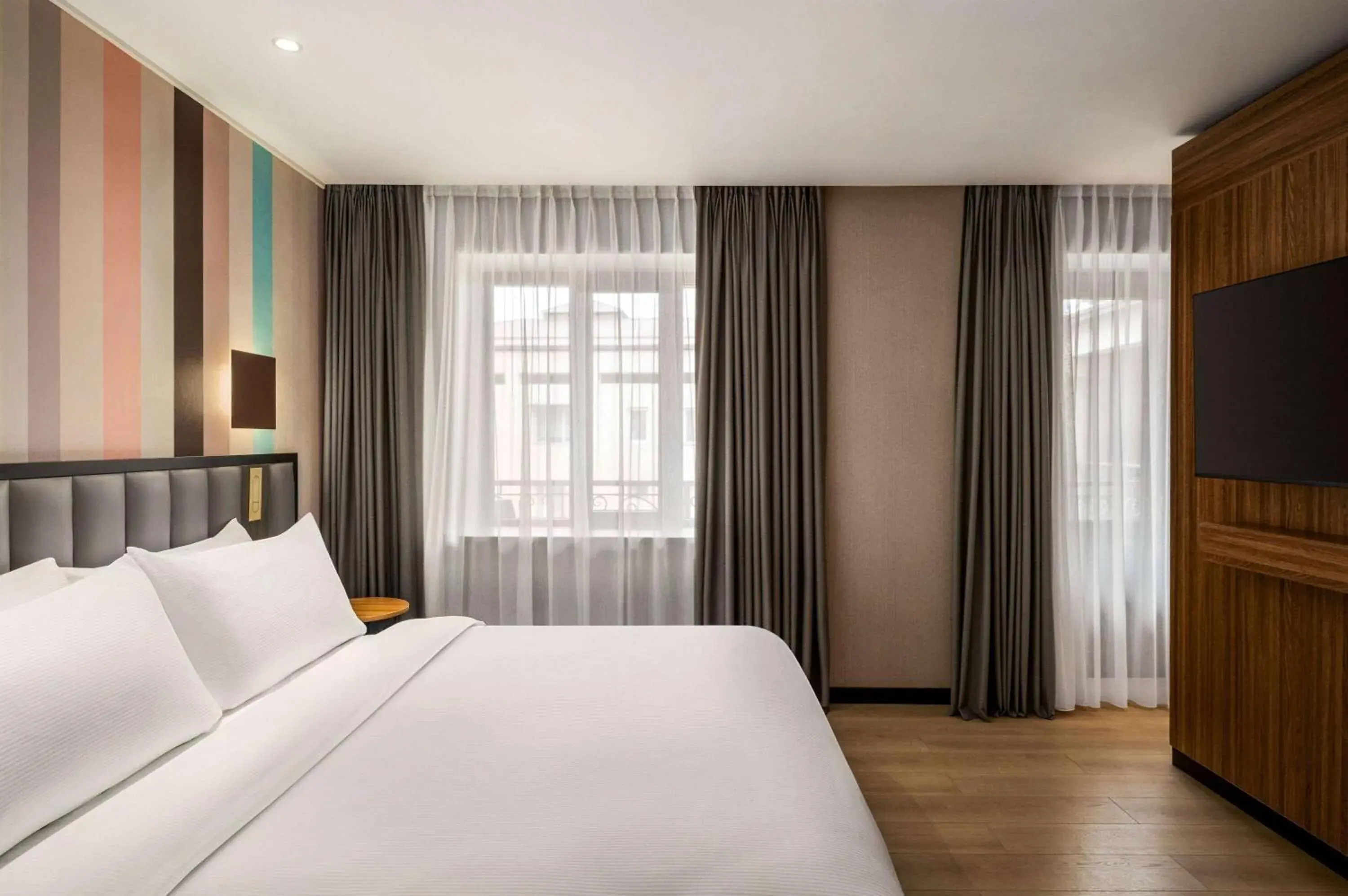 Bed in Ramada Encore by Wyndham Tashkent Bed in Ramada Encore by Wyndham Tashkent