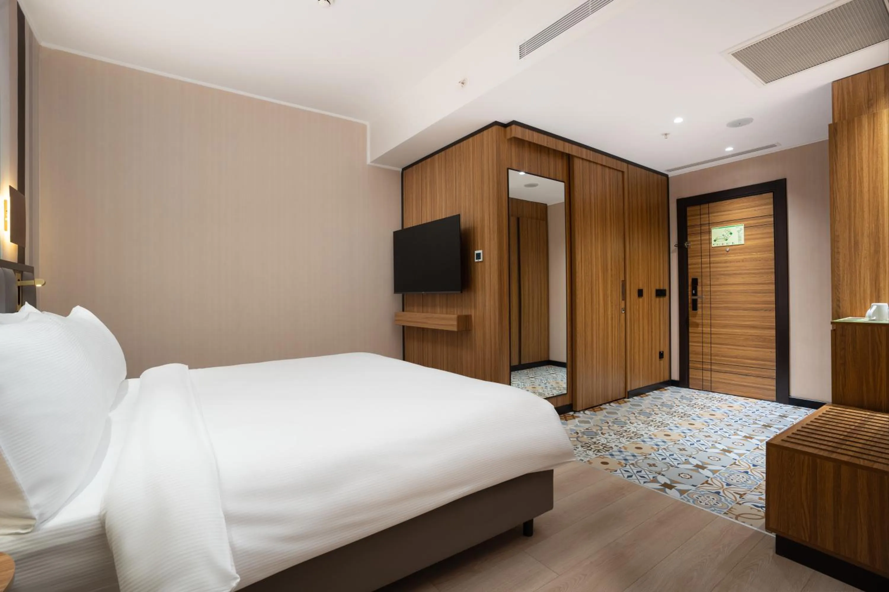 Communal lounge/ TV room, Bed in Ramada Encore by Wyndham Tashkent