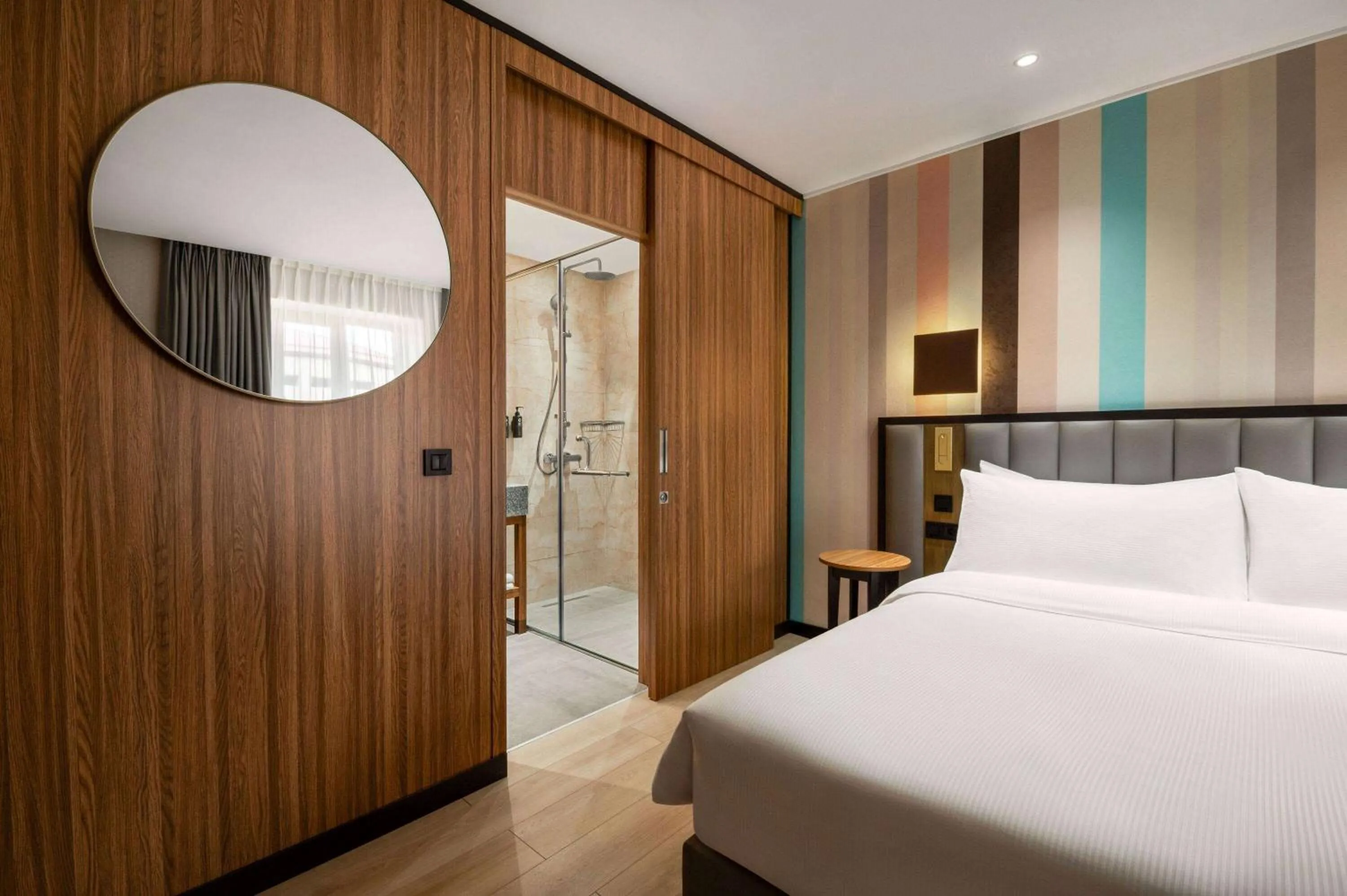 Bed in Ramada Encore by Wyndham Tashkent