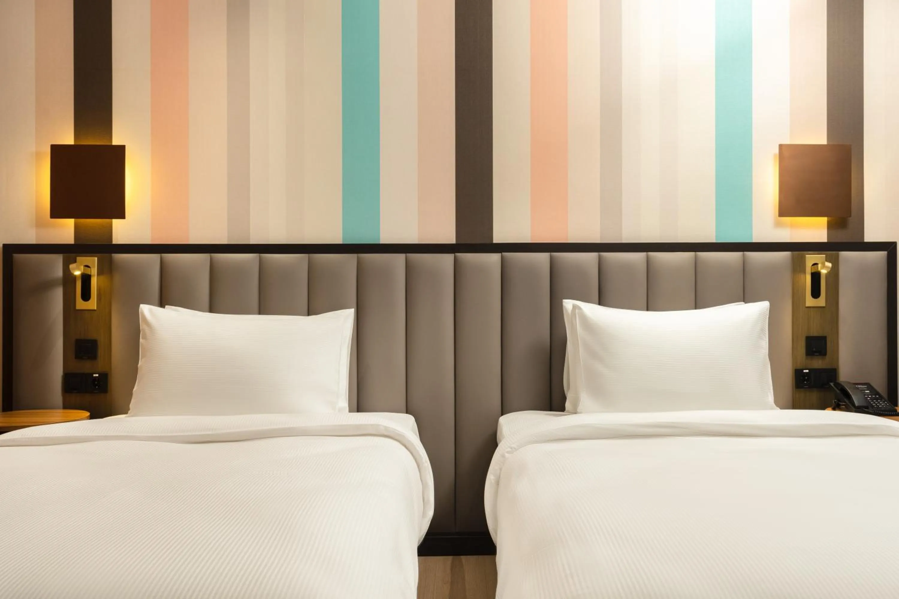 Bed in Ramada Encore by Wyndham Tashkent