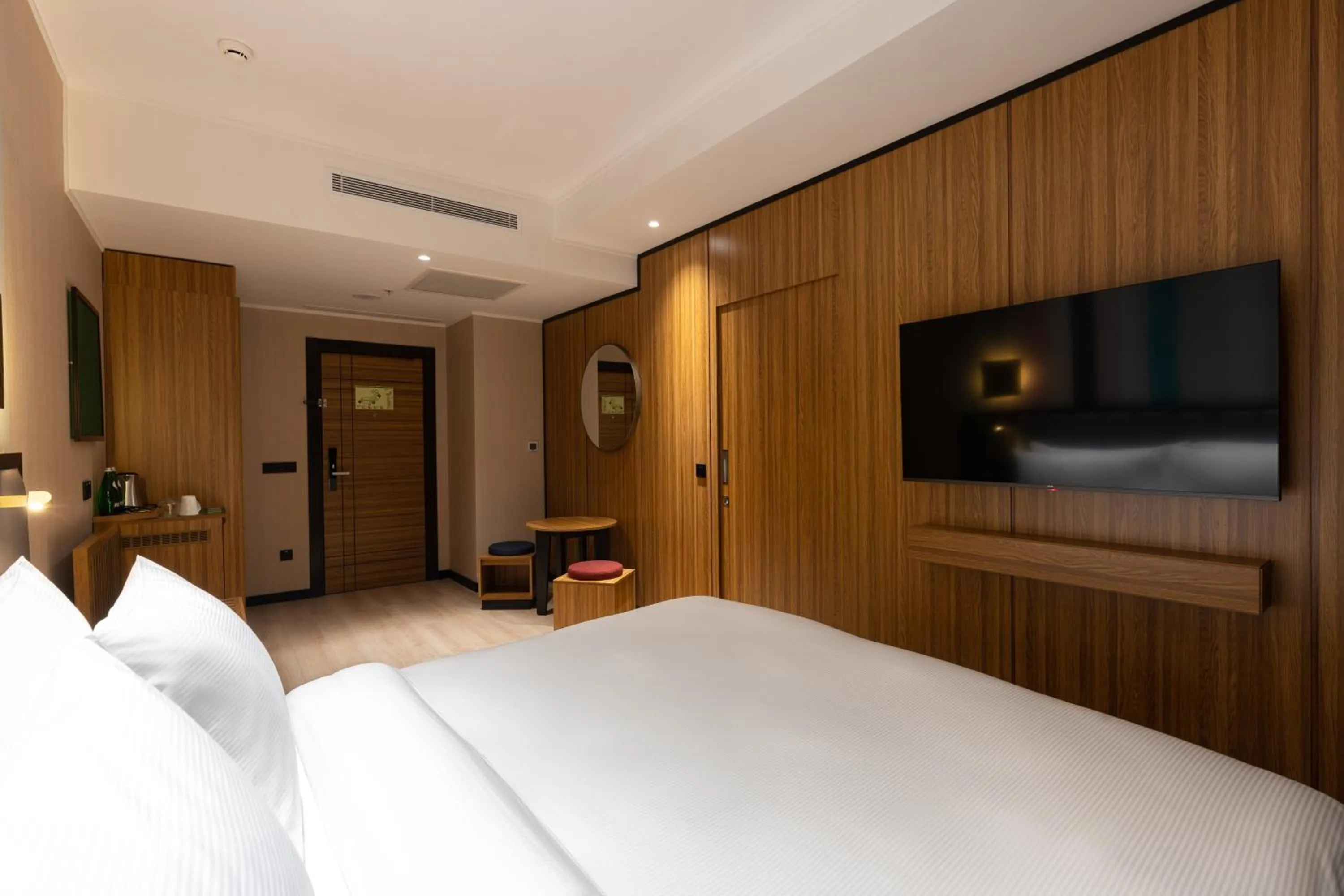 Communal lounge/ TV room, Bed in Ramada Encore by Wyndham Tashkent