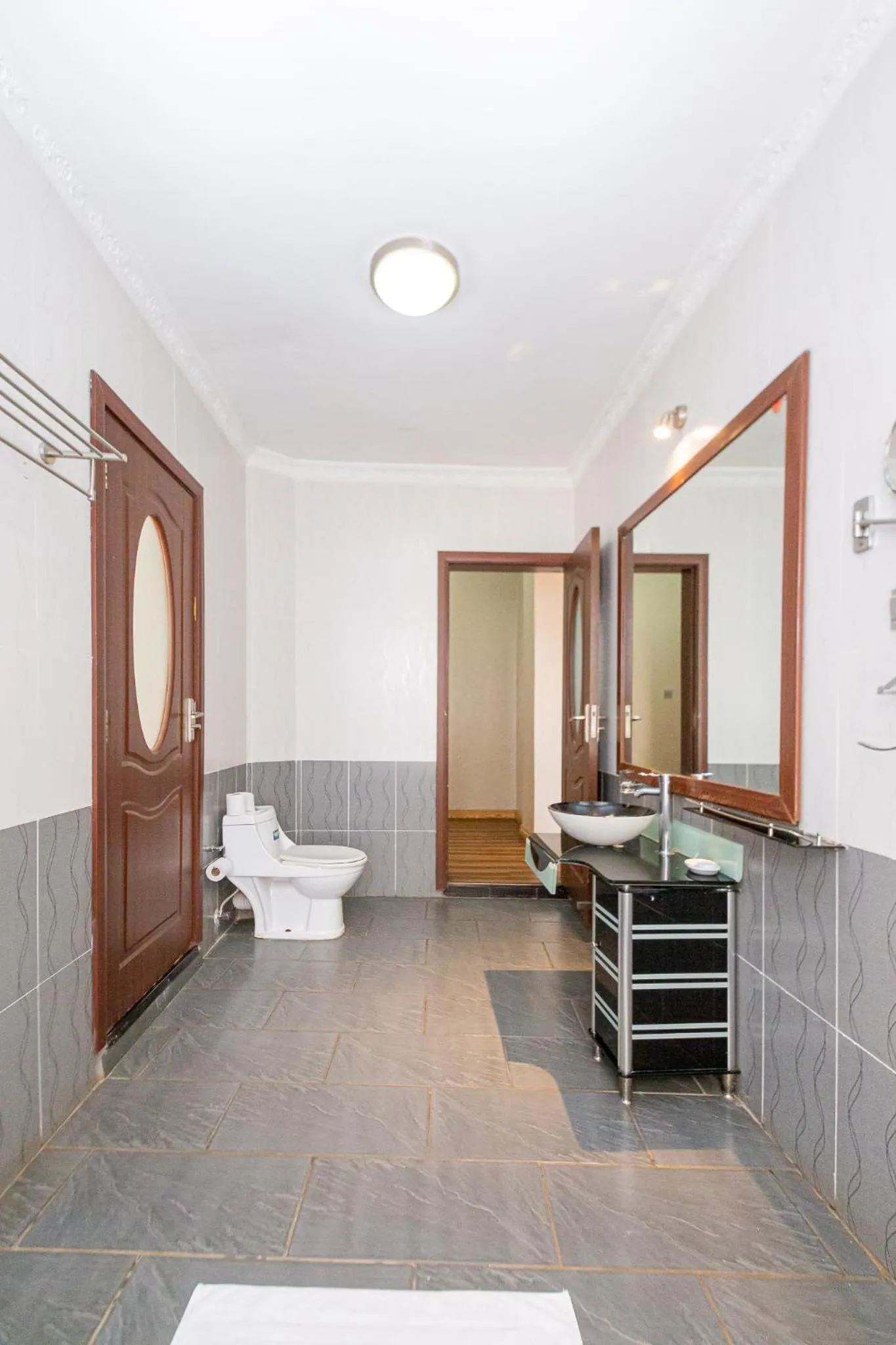 Toilet in Eldon Apartments & Suites