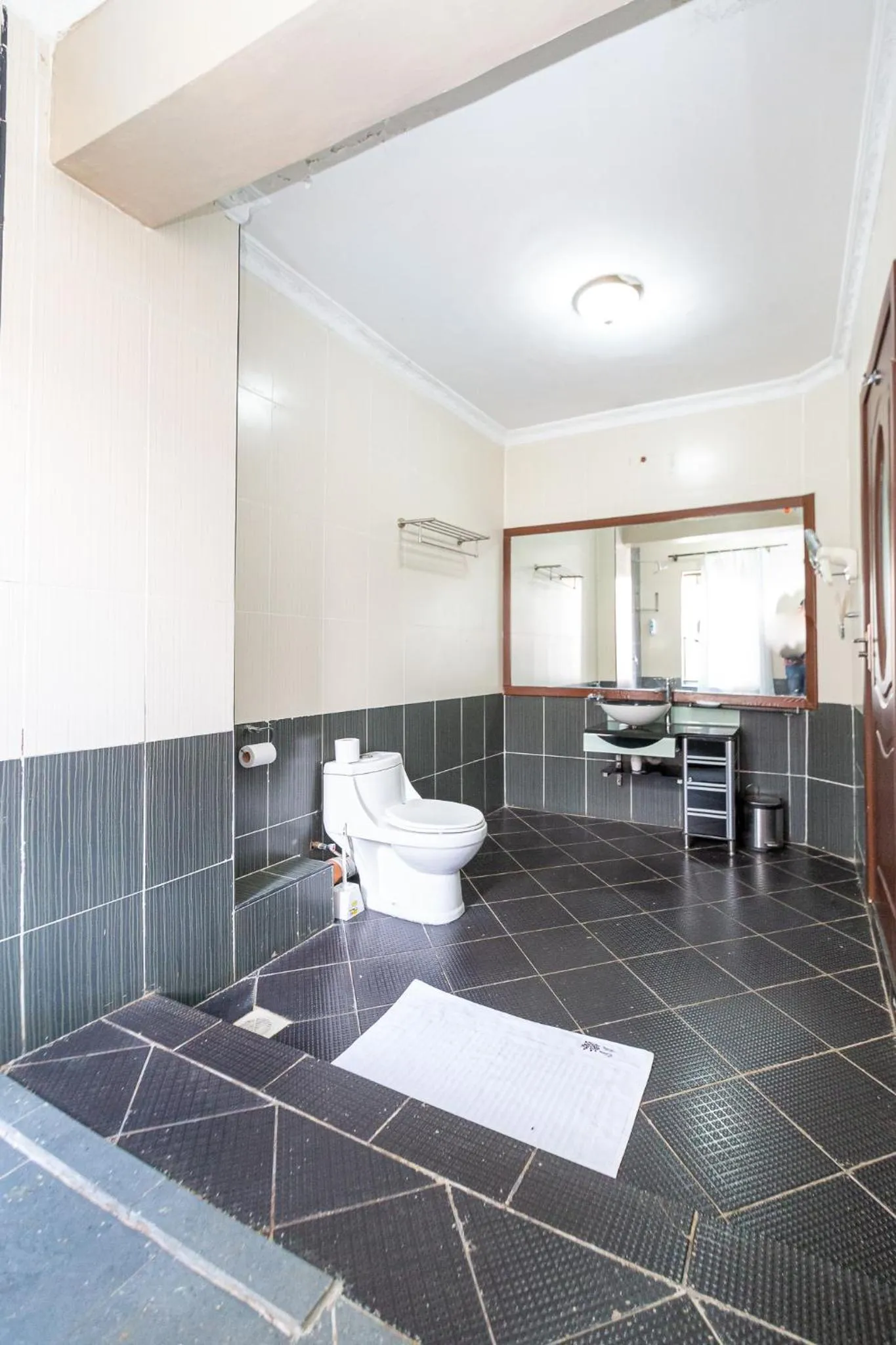 Toilet in Eldon Apartments & Suites