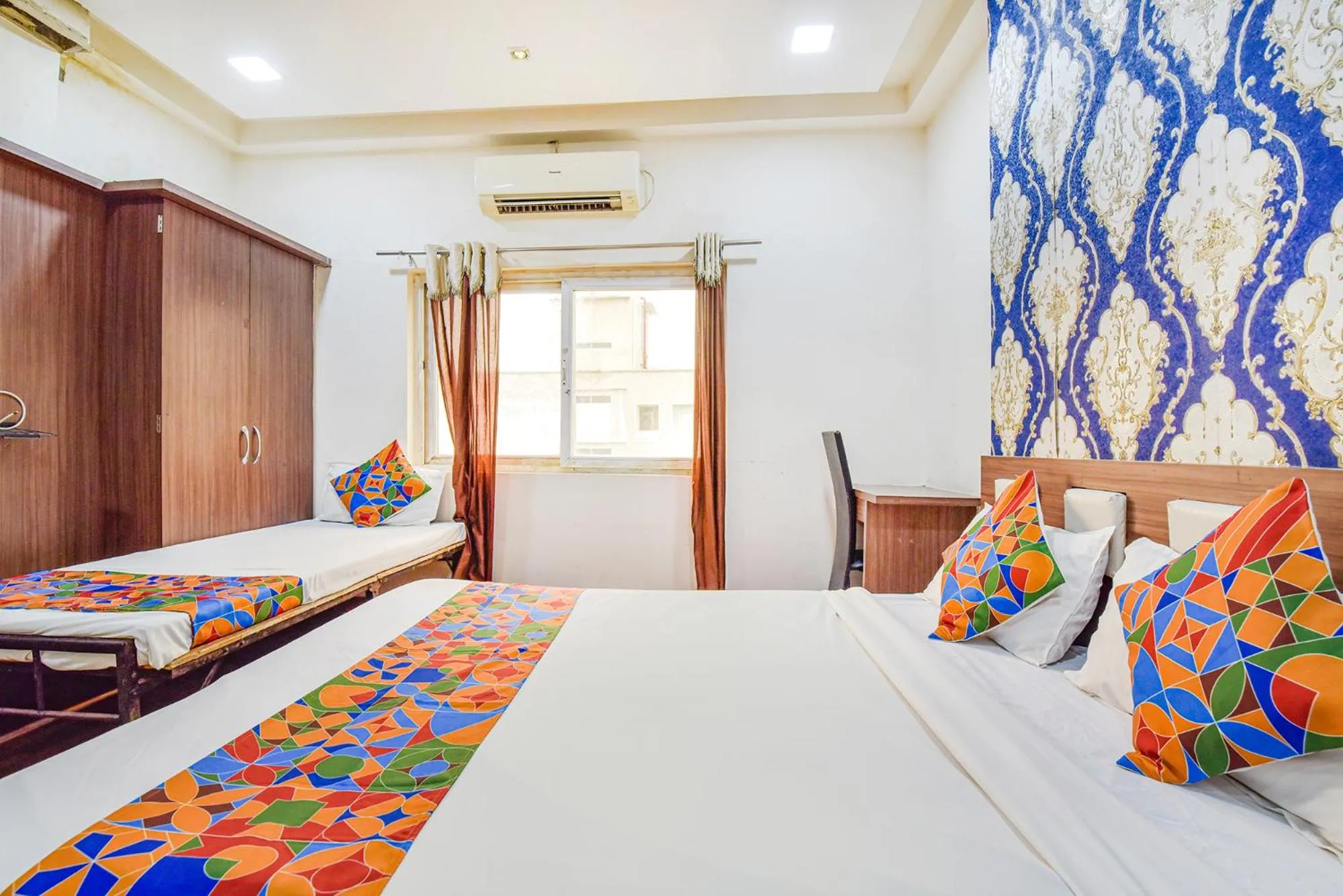 Bed in FabHotel Shri Shyam Palace