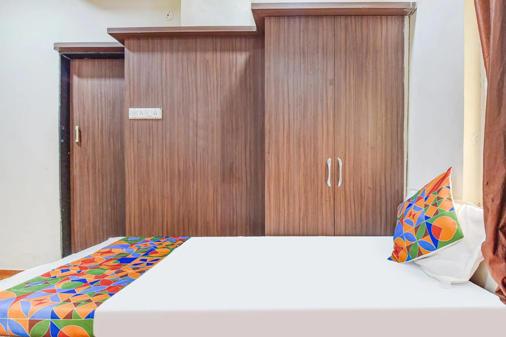 Bed in FabHotel Shri Shyam Palace