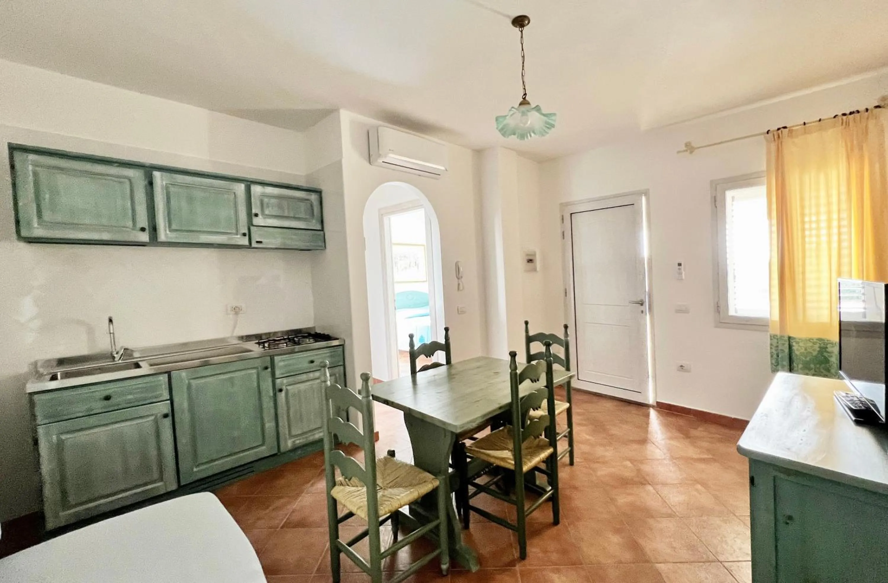 Kitchen or kitchenette in Residence in Orosei apartments with air conditioning and private outdoor area