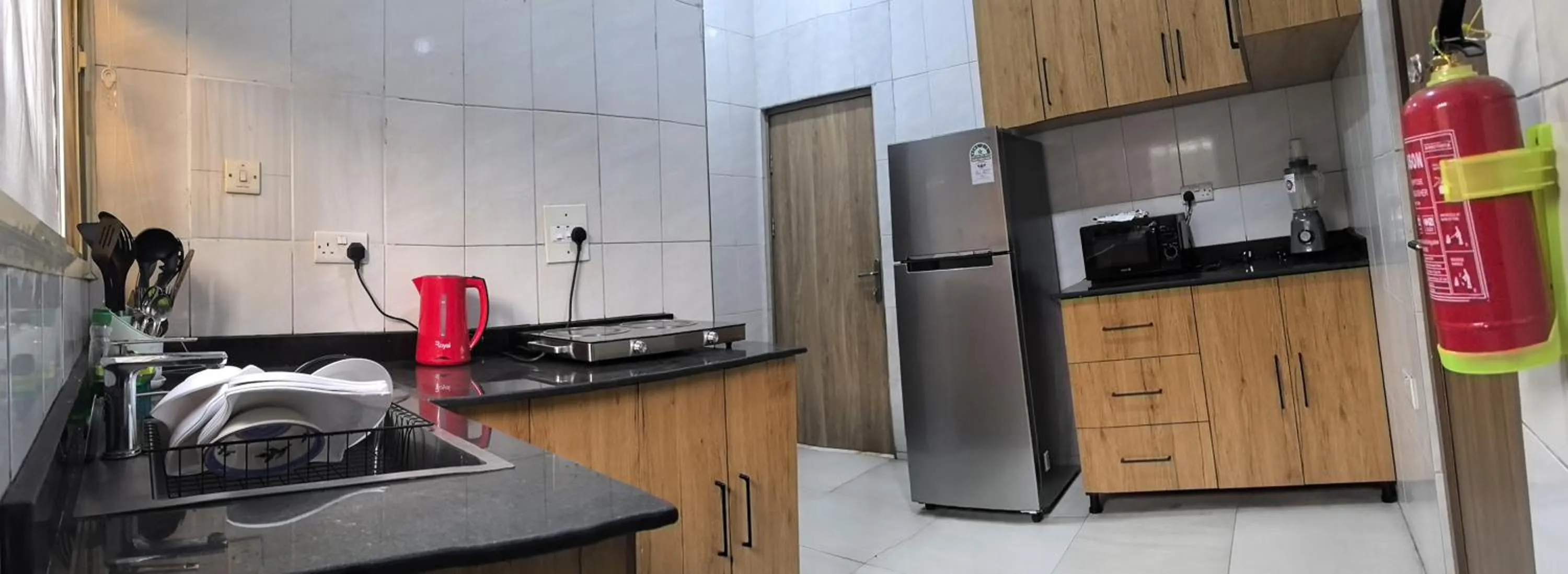 Kitchen or kitchenette in Schemes Hotel And Apartment