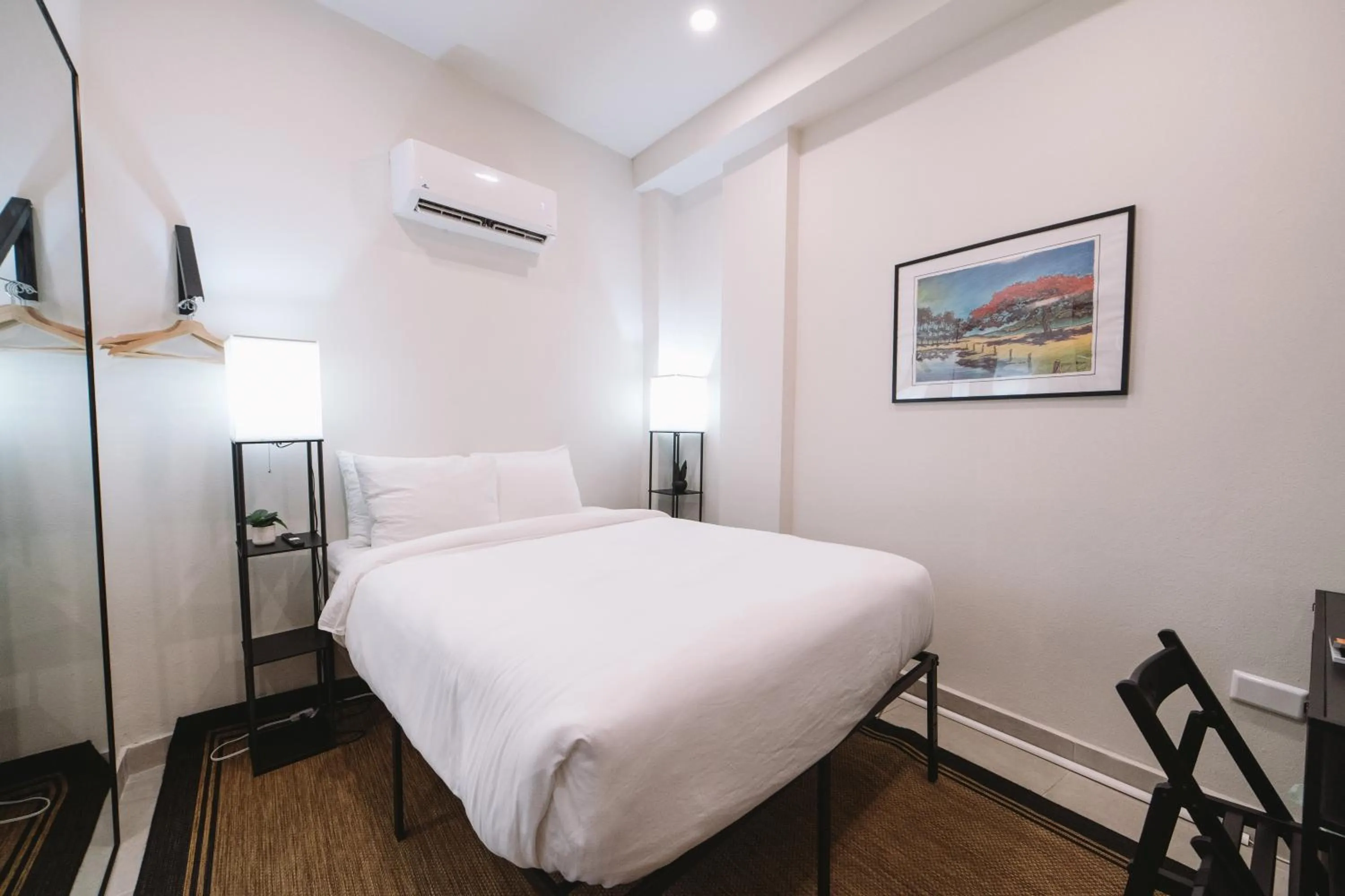 Bed in The Looking Glass Hotel