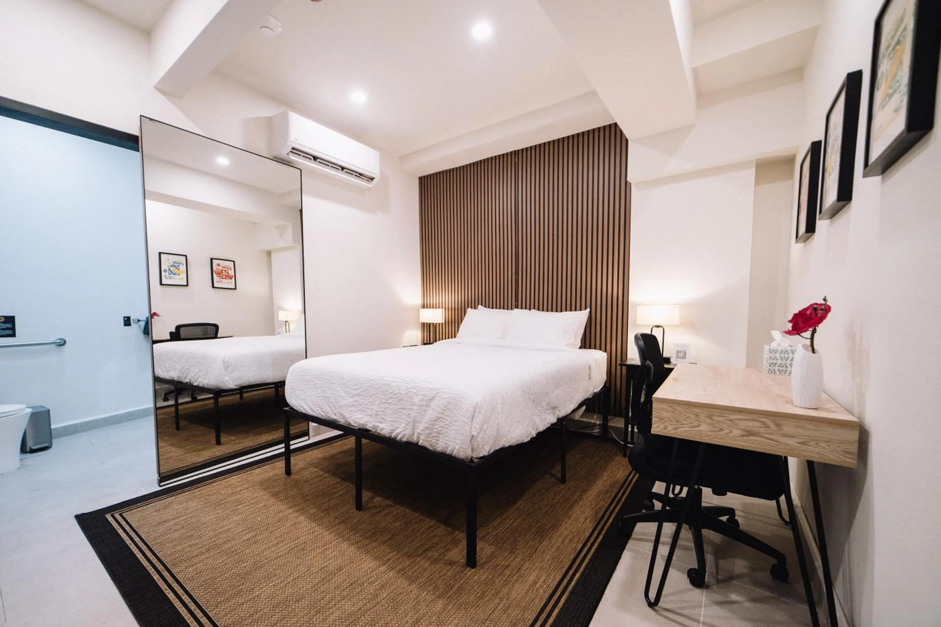 Photo of the whole room, Bed in The Looking Glass Hotel