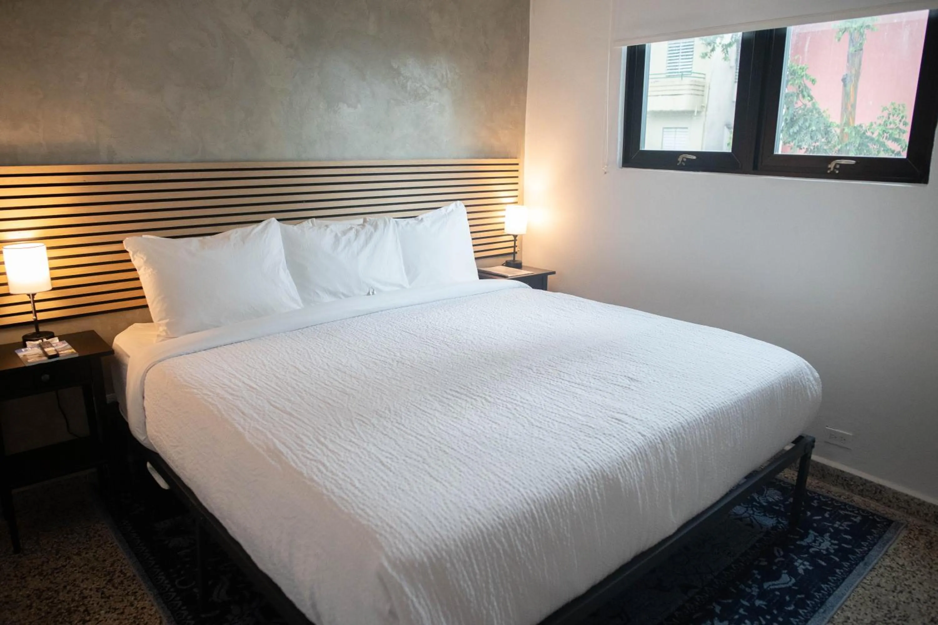 Bed in The Looking Glass Hotel