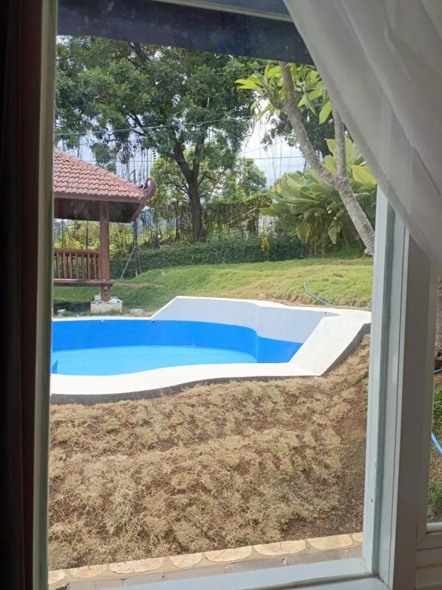 Swimming pool in NK Villa Syariah And Cafe Prigen
