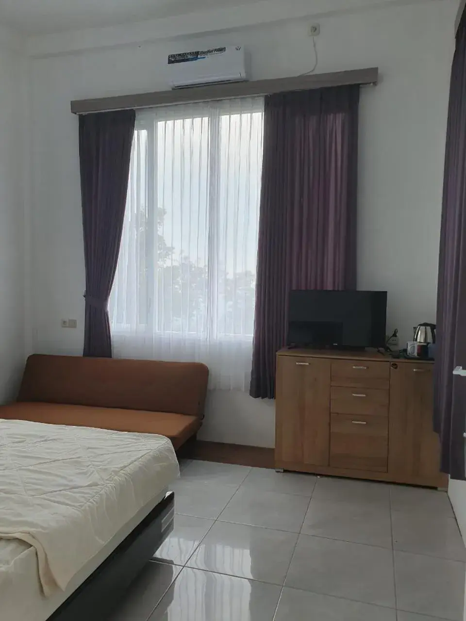 Bed in NK Villa Syariah And Cafe Prigen Bed in NK Villa Syariah And Cafe Prigen