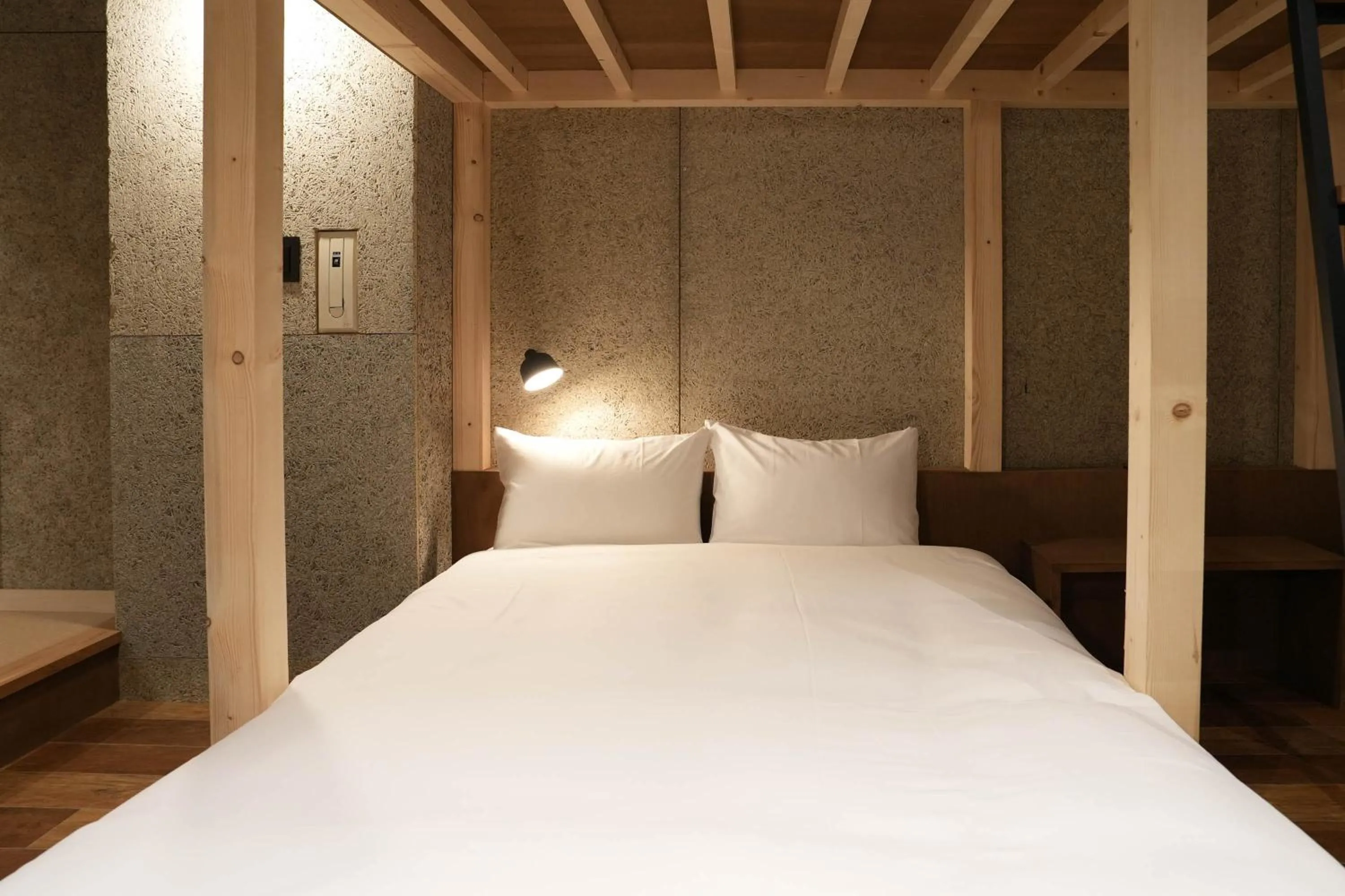 Bed in Green Room Hotel