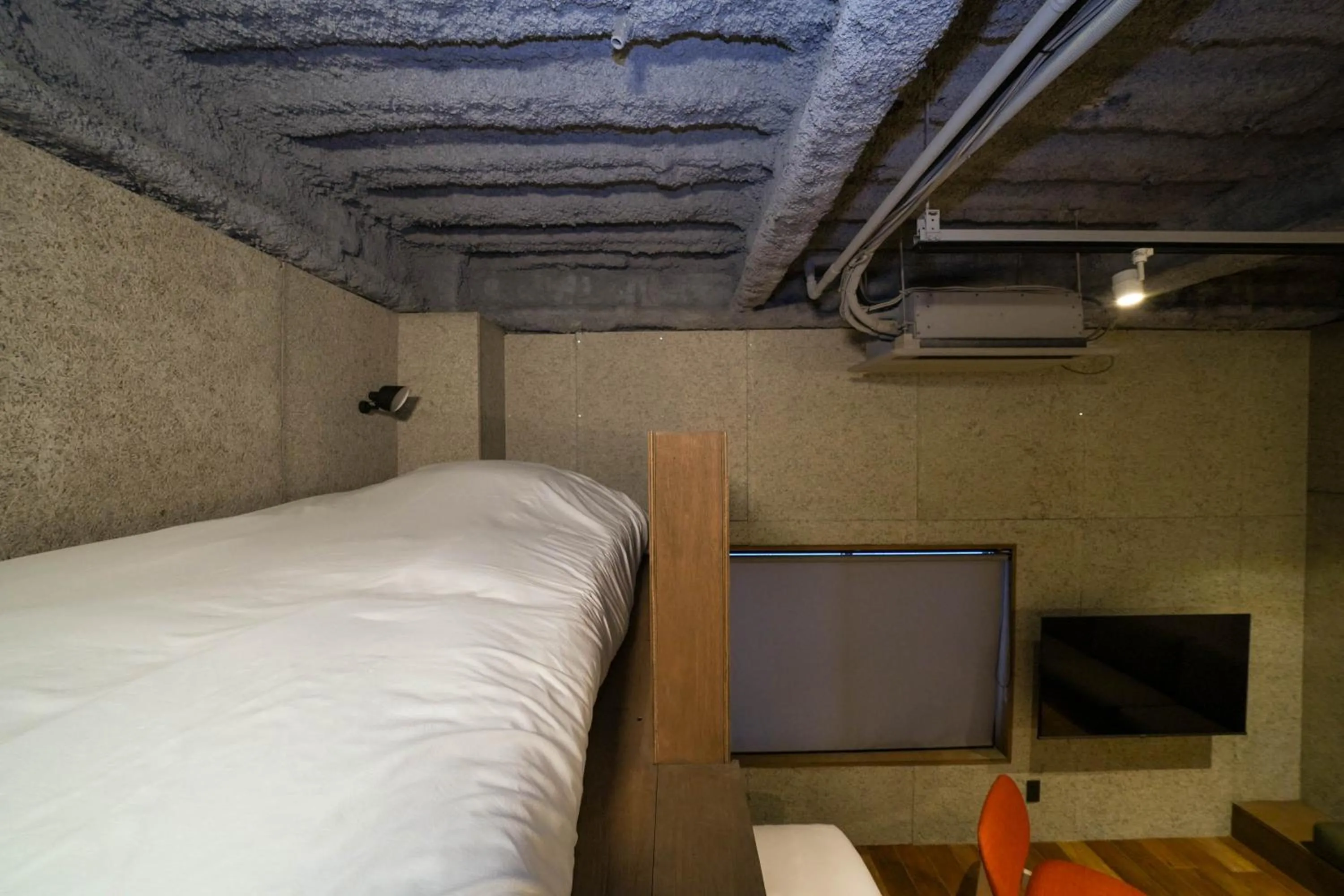 Bed in Green Room Hotel