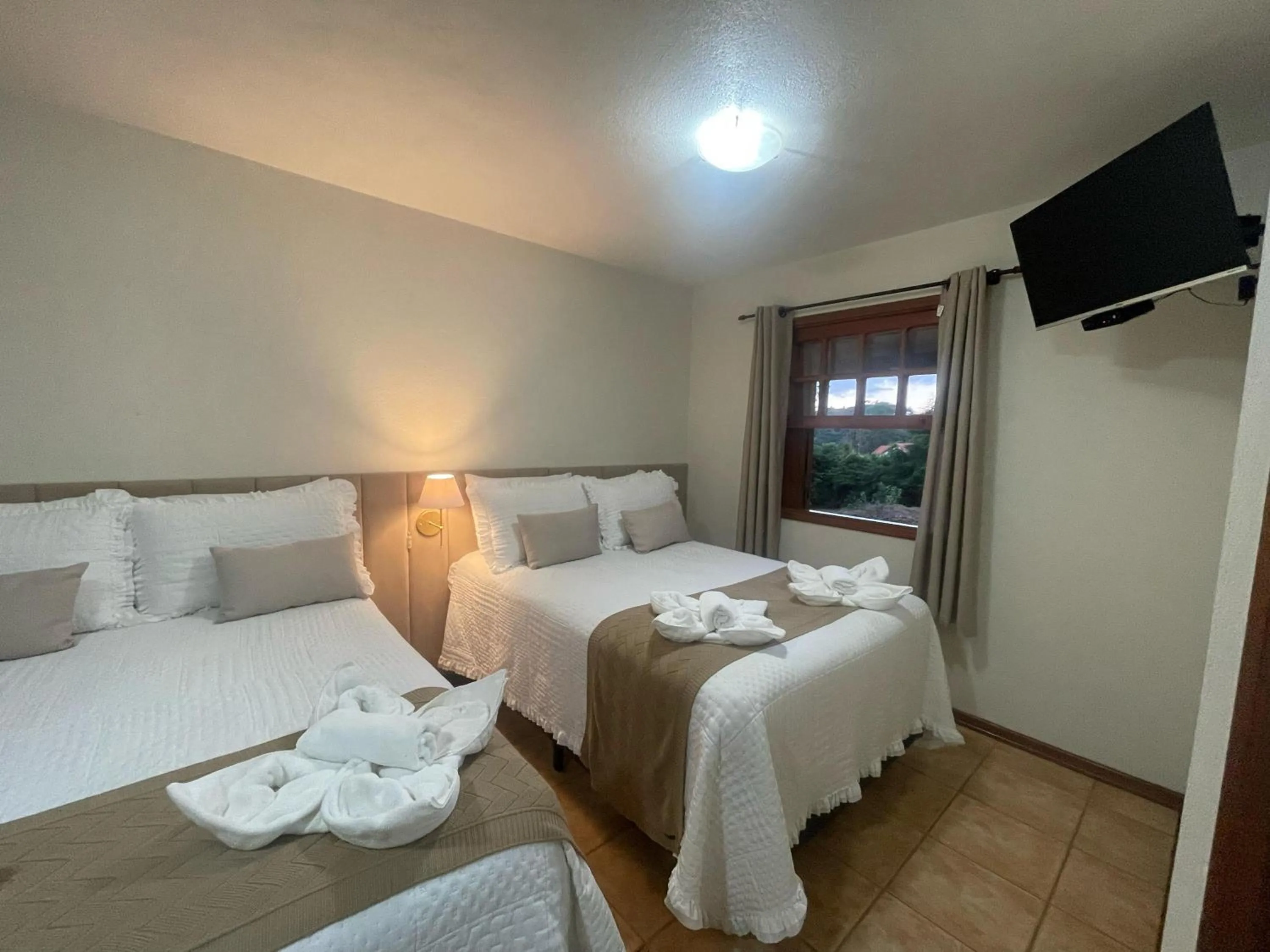 Bed in Pousada Flor de Lua Monte Verde