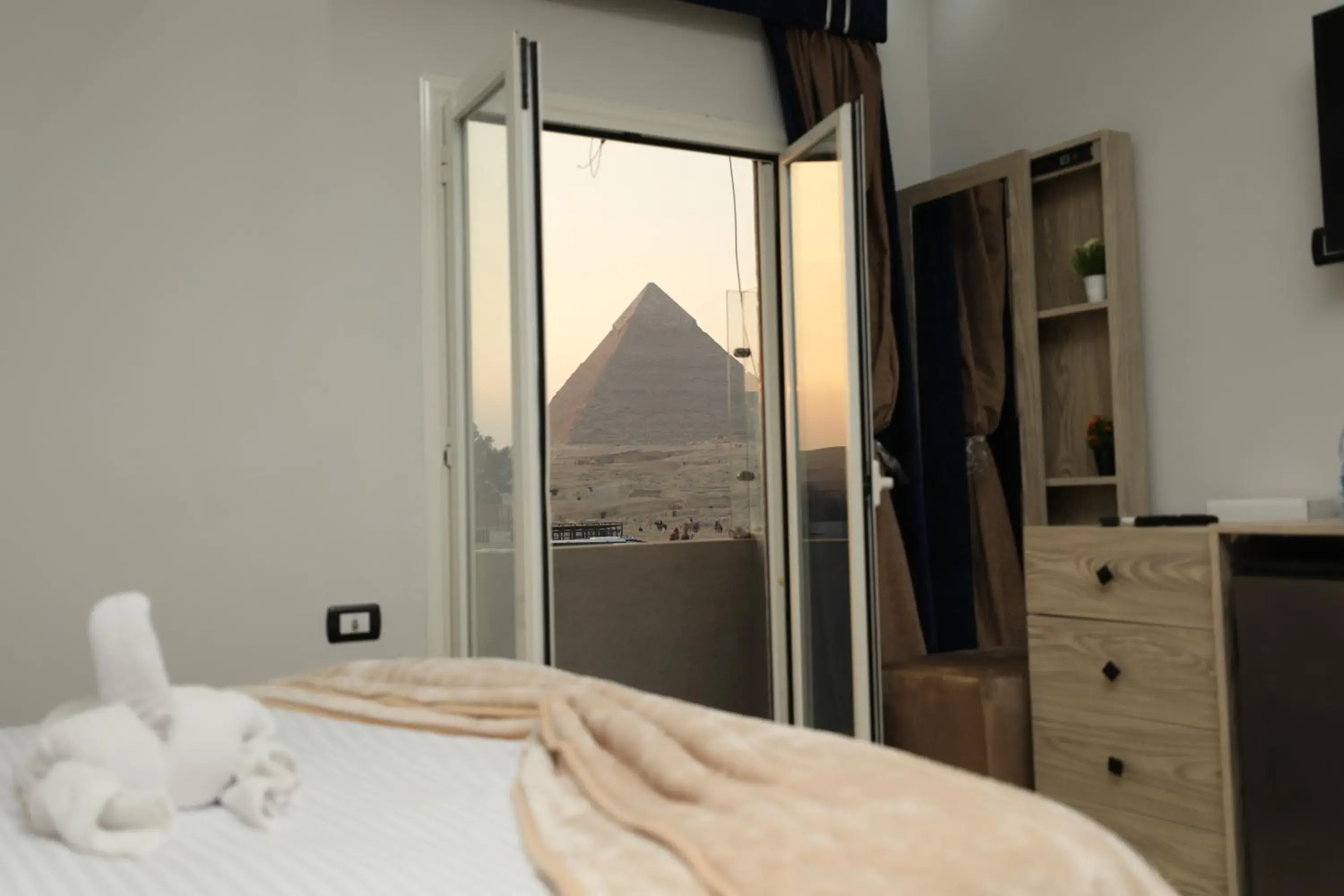 Landmark view, Bed in Capital Of Pyramids Hotel Landmark view, Bed in Capital Of Pyramids Hotel