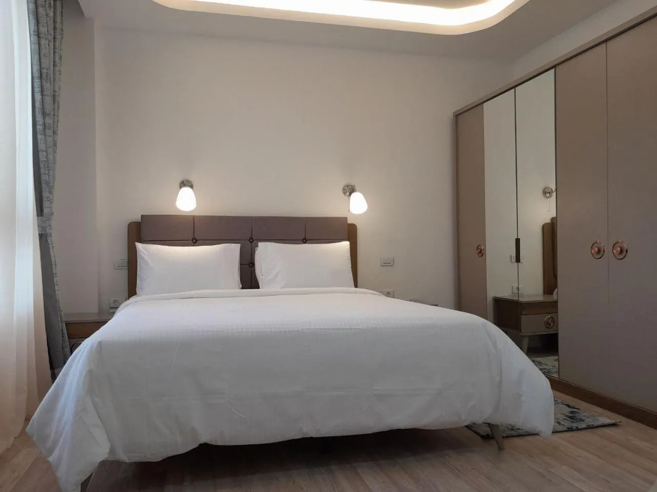 Bed in Zemilo Hotel Apartment