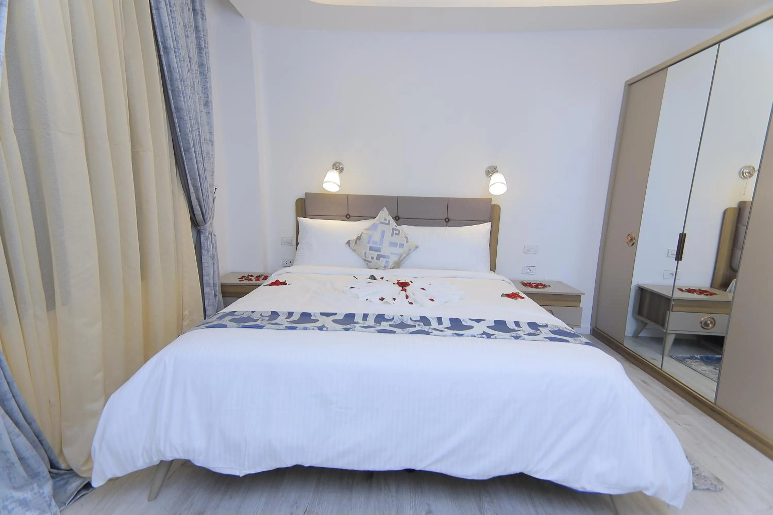 Bed in Zemilo Hotel Apartment