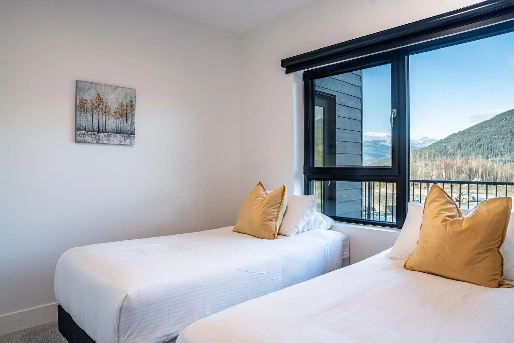 Bed in Mountainside Revival by Revelstoke Vacations