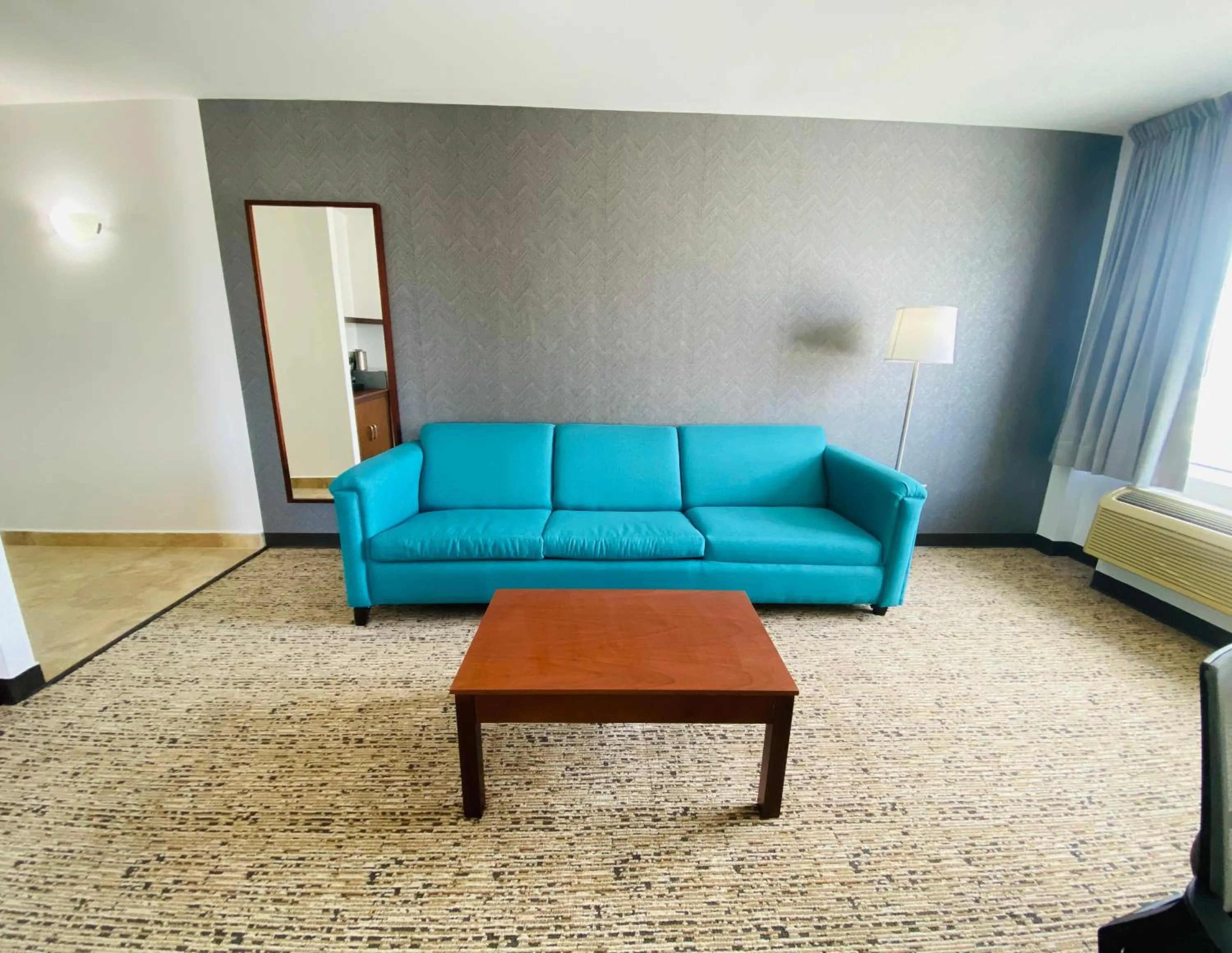 Living room in La Quinta by Wyndham Reynosa