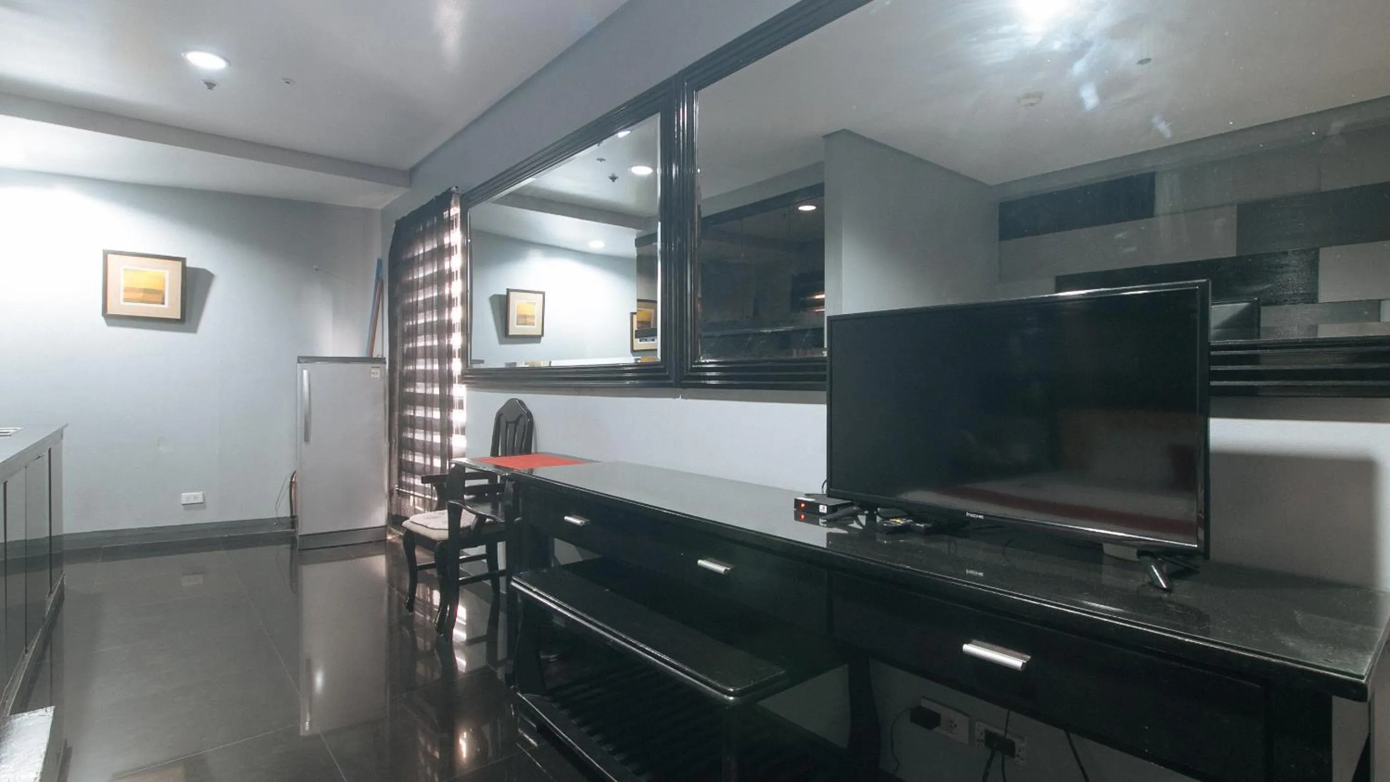 TV and multimedia in RedDoorz at TJMG by Bel Air Polaris Makati