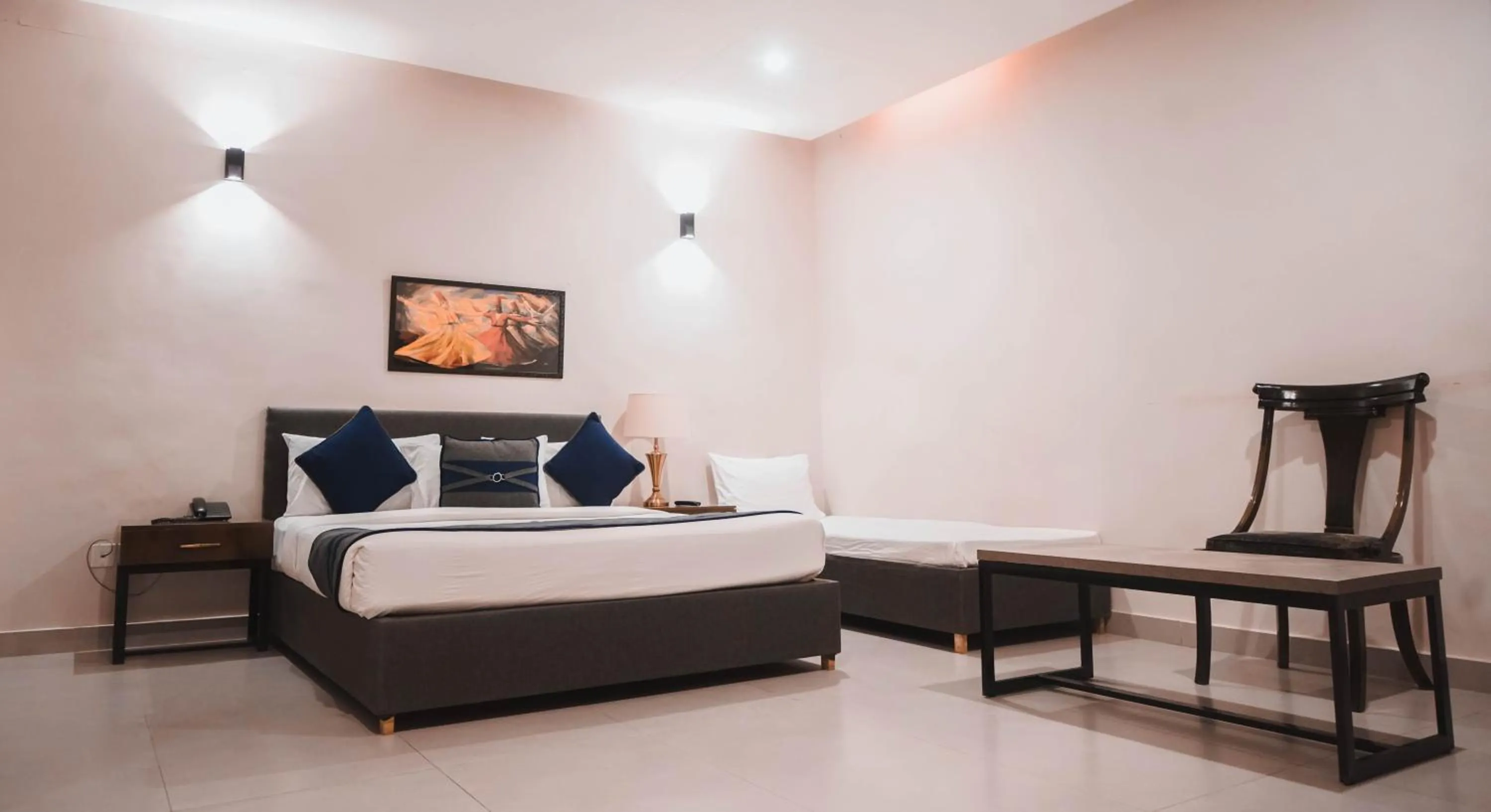 Bed in The Garden Hotel