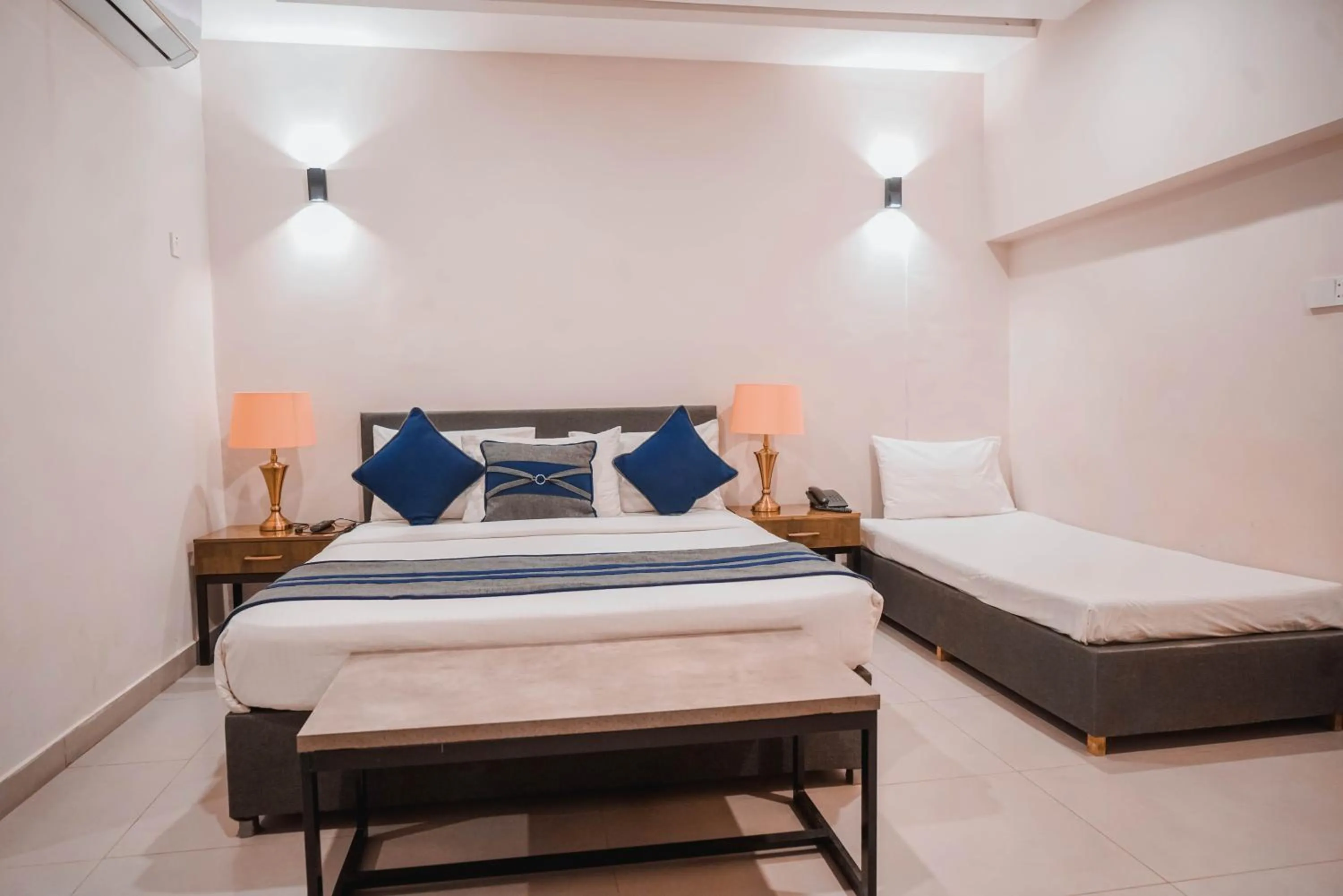 Bed in The Garden Hotel