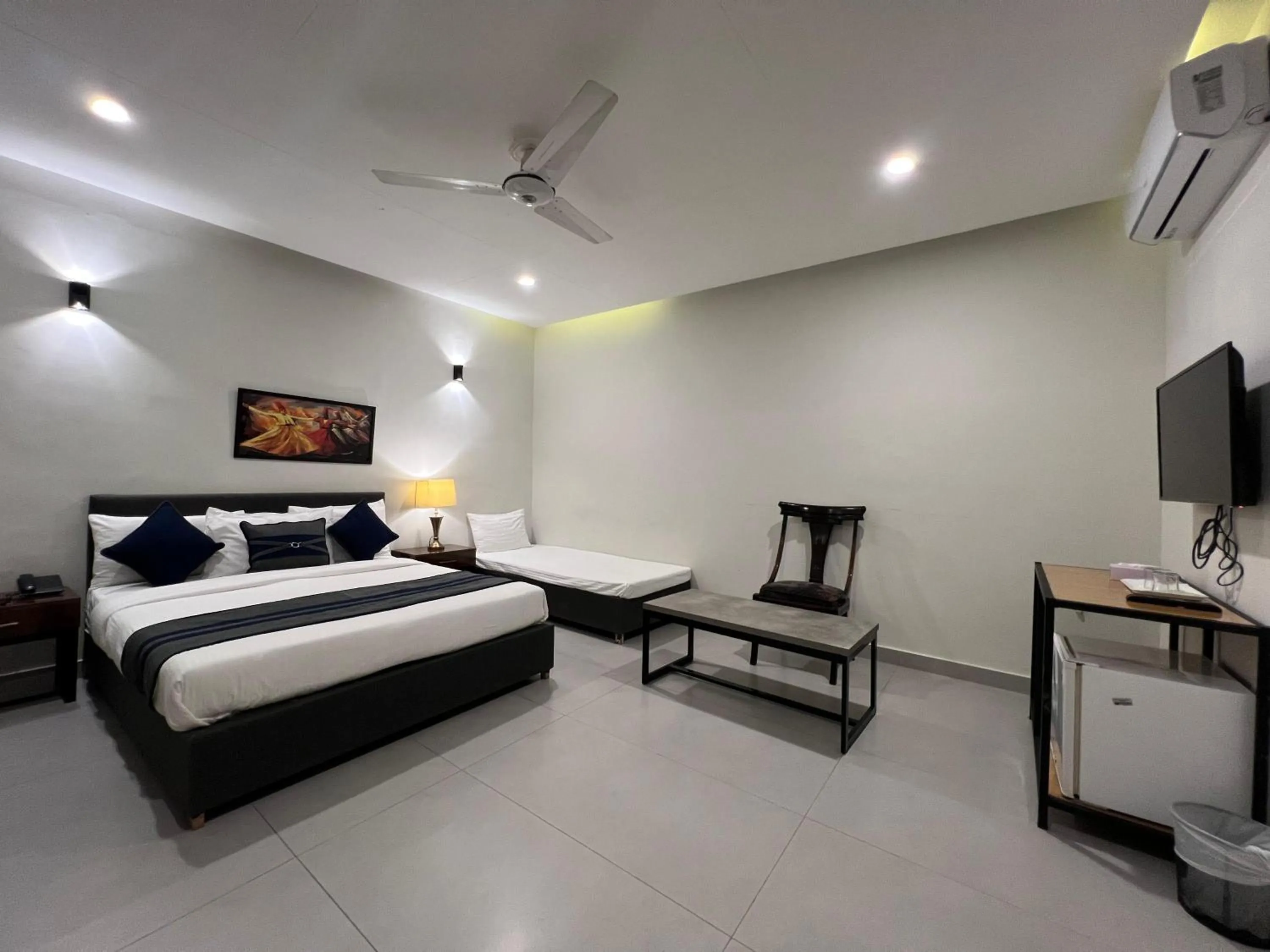 Bed in The Garden Hotel