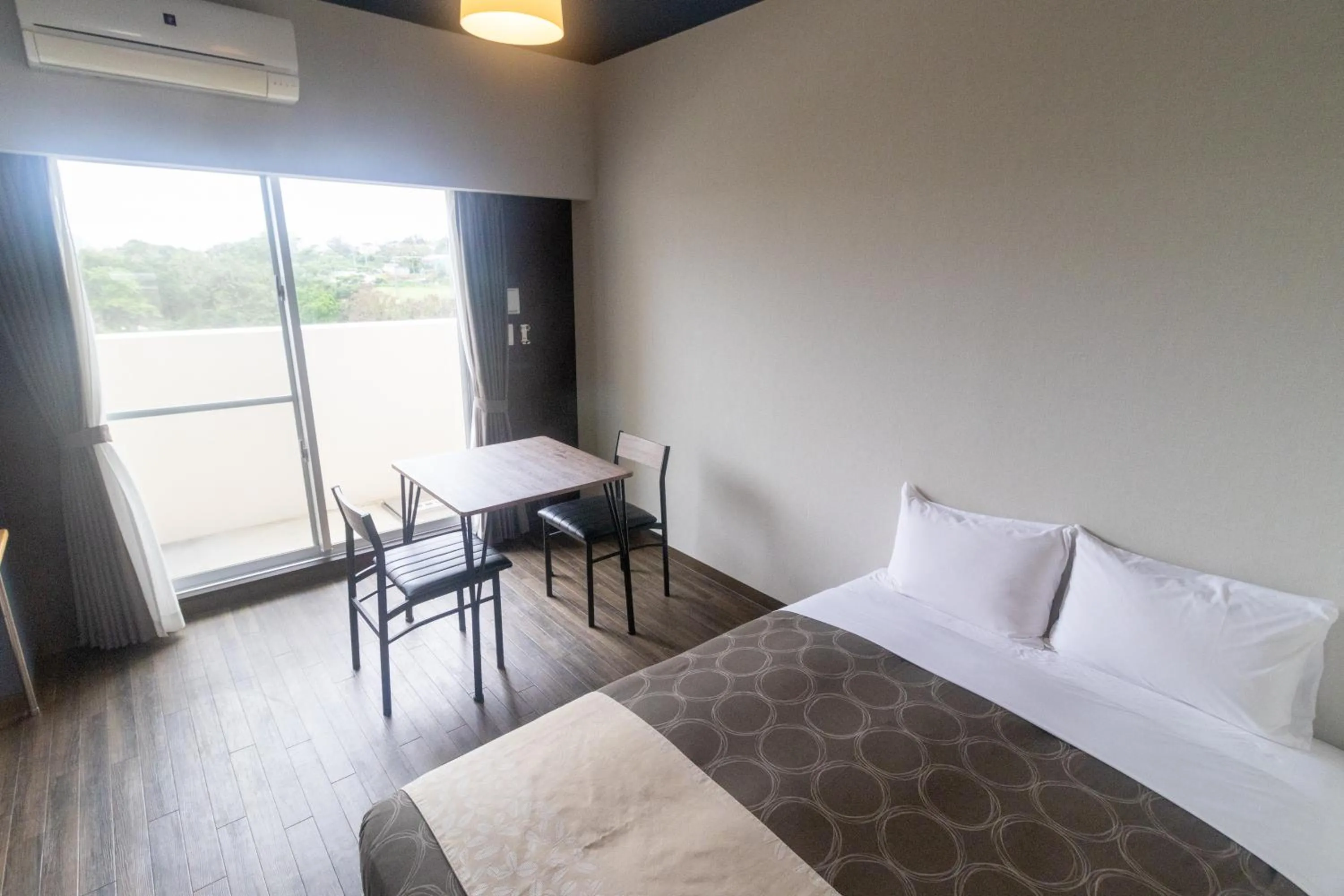 Bed in HOTEL Progress inn 名護 MATABee