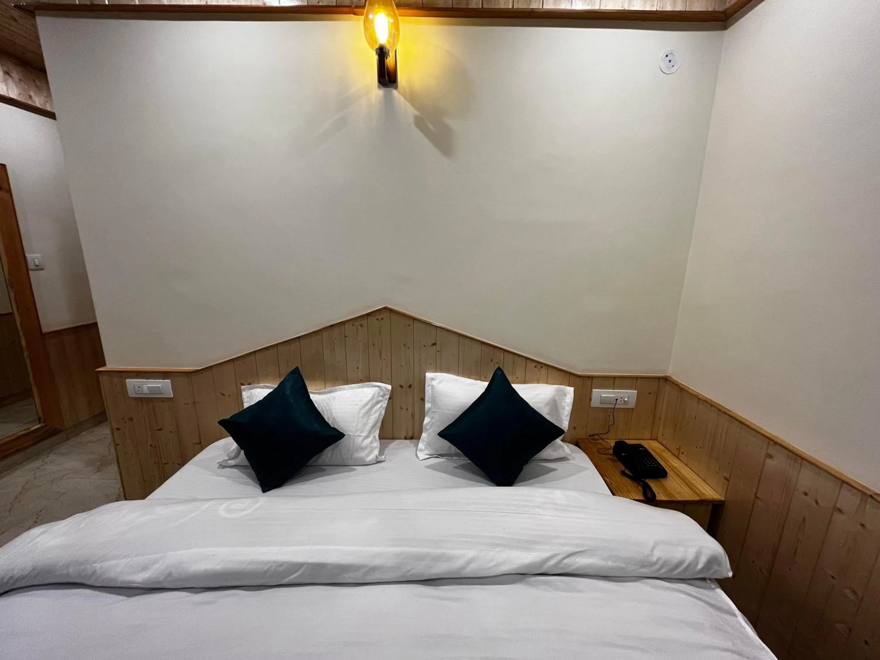 Bedroom, Bed in Hotel Mid Orchard Kasol l River Side -Pure Veg Hotel