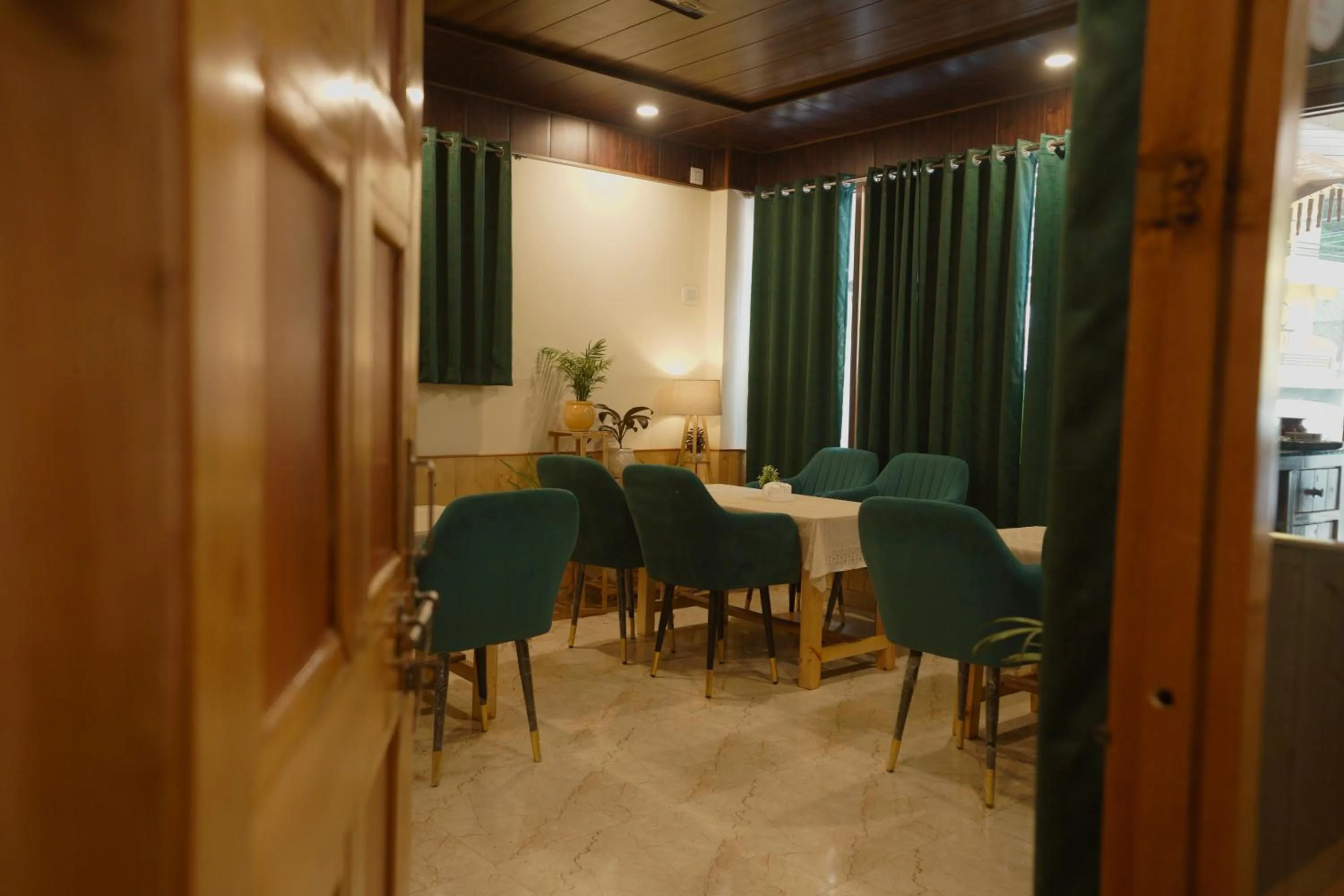 Dining area in Hotel Mid Orchard Kasol l River Side -Pure Veg Hotel