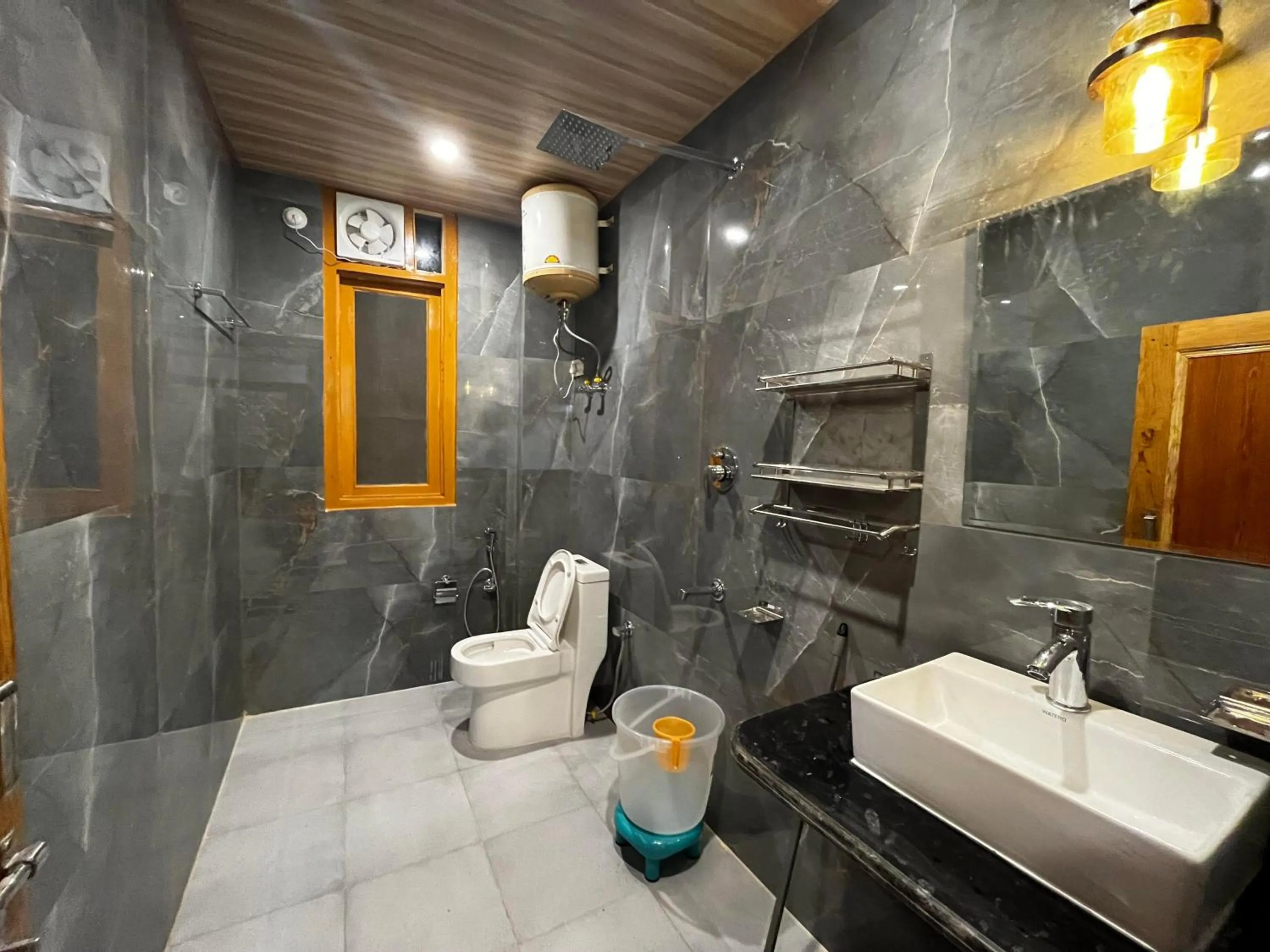 Shower in Hotel Mid Orchard Kasol l River Side -Pure Veg Hotel