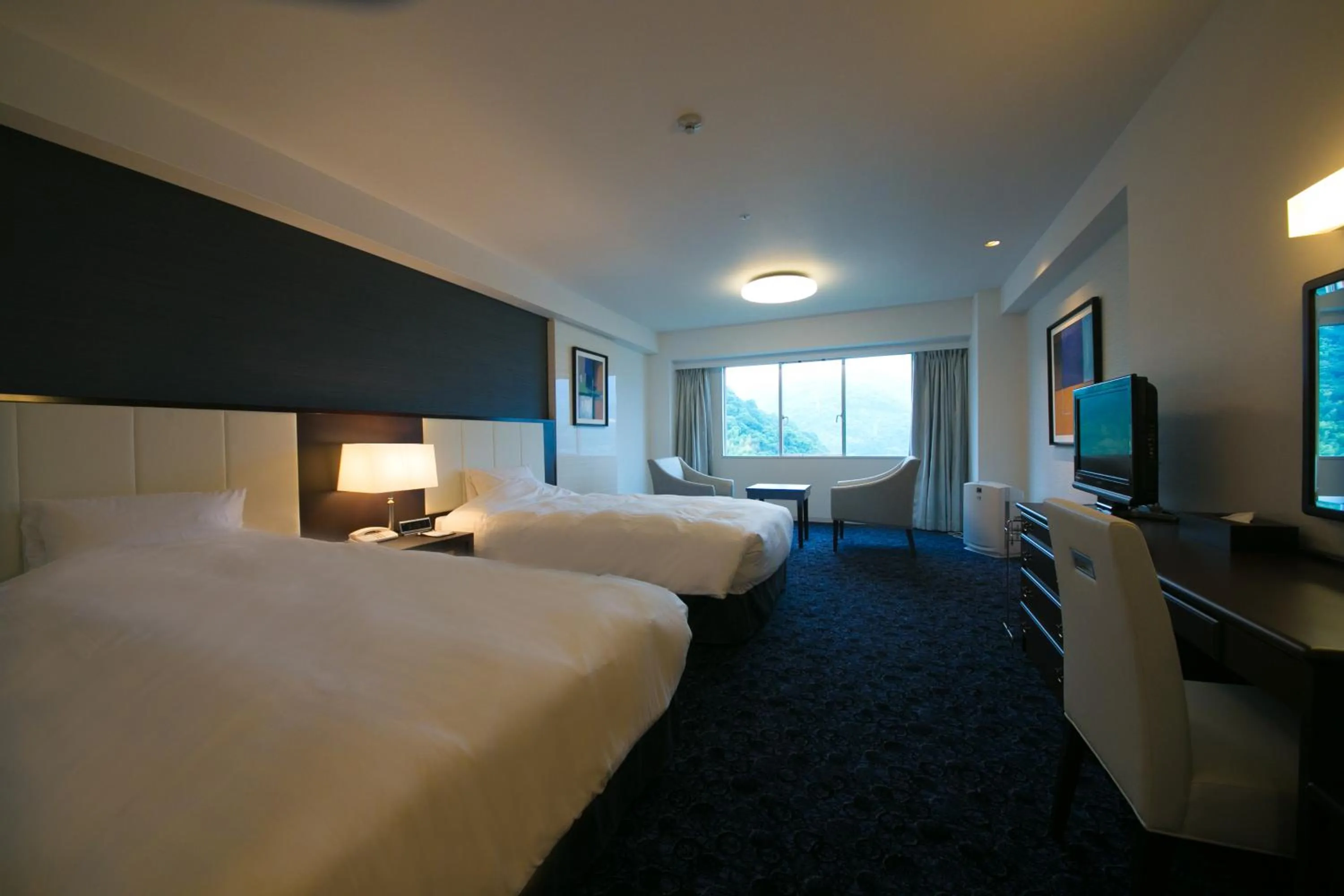 Photo of the whole room, Bed in Grand Mercure Beppu Bay Resort & Spa