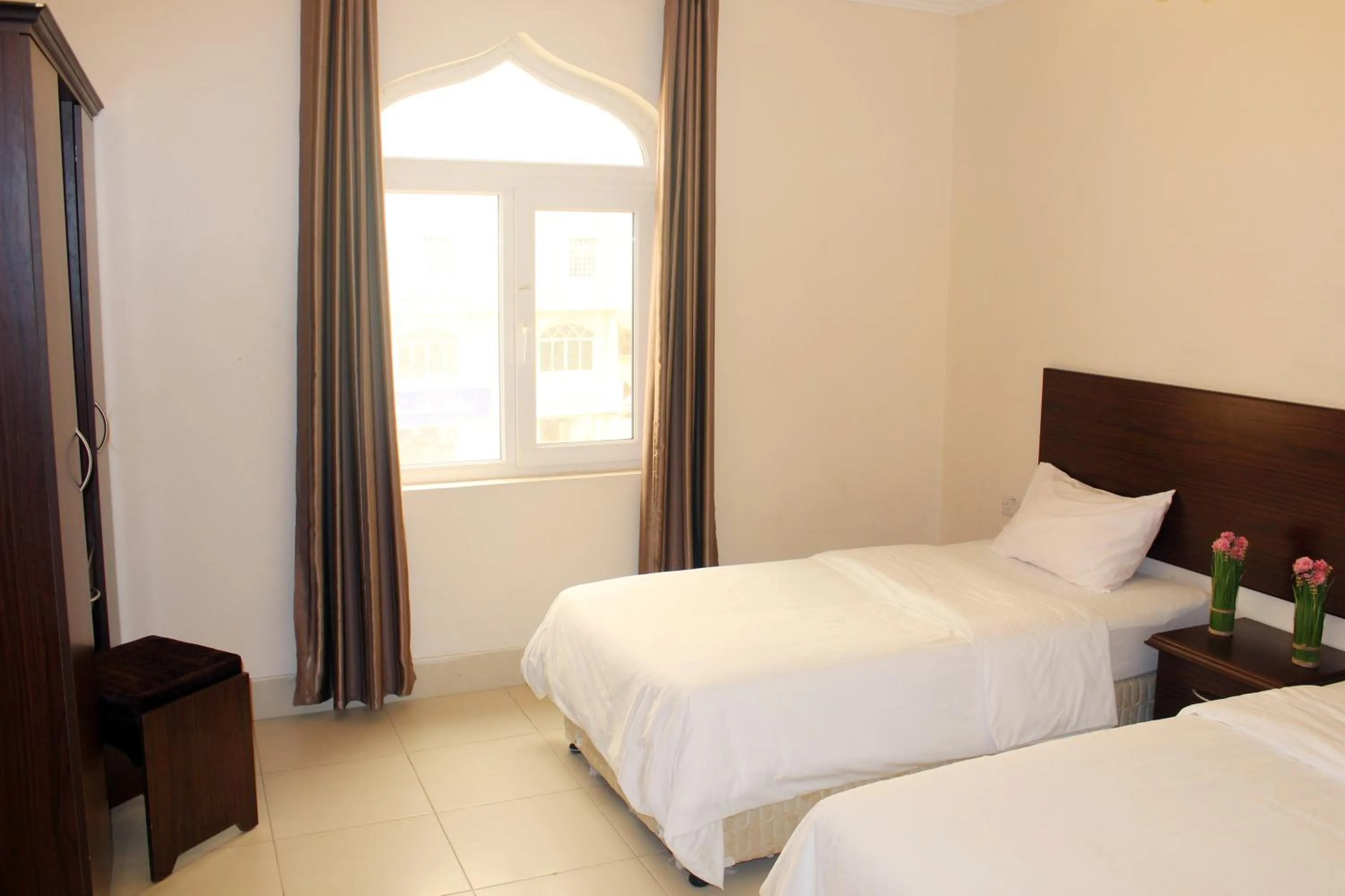 Bedroom, Bed in Al Noor Furnished Flats