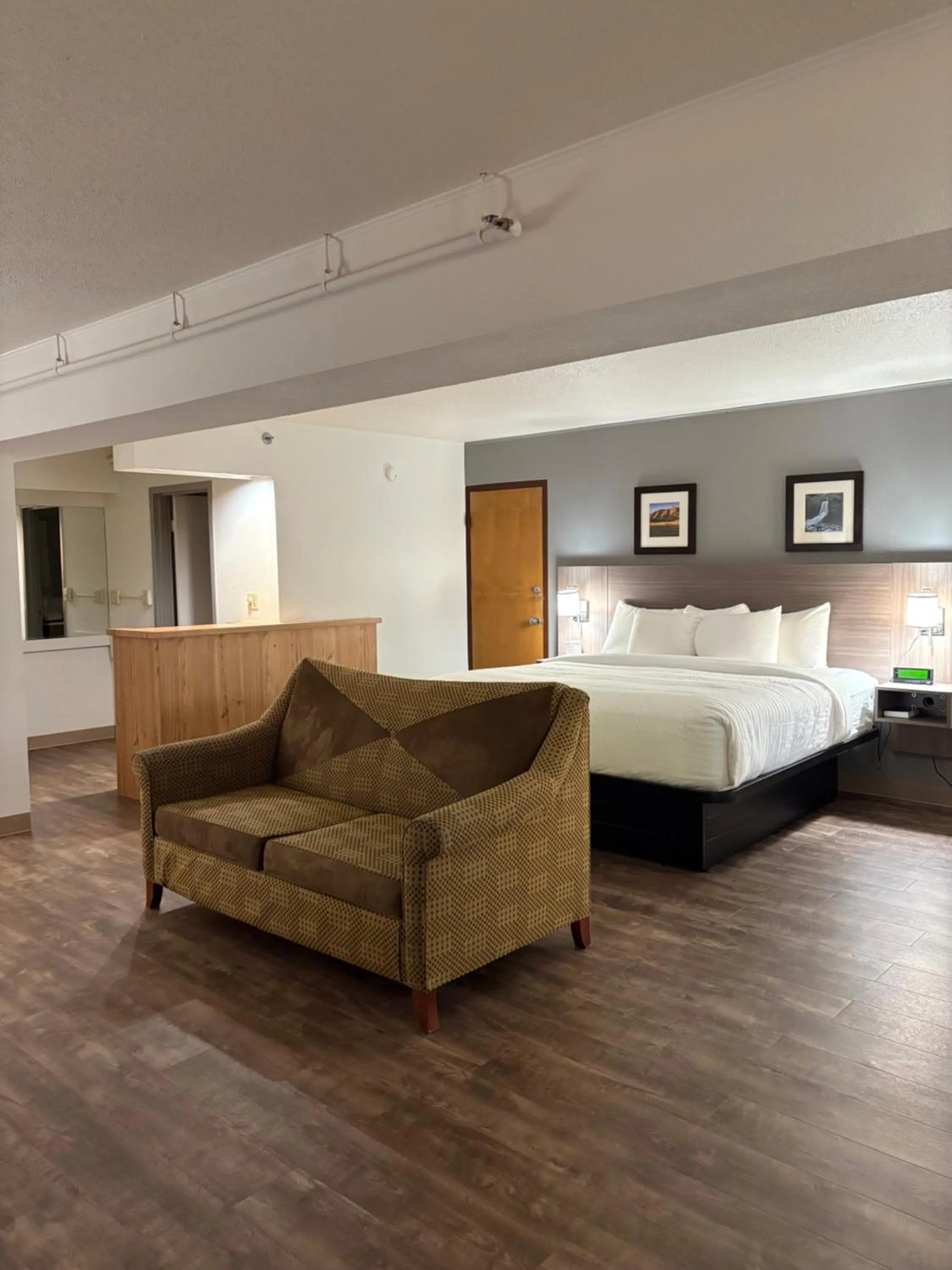 Bed in Clarion Inn & Suites and Convention Center