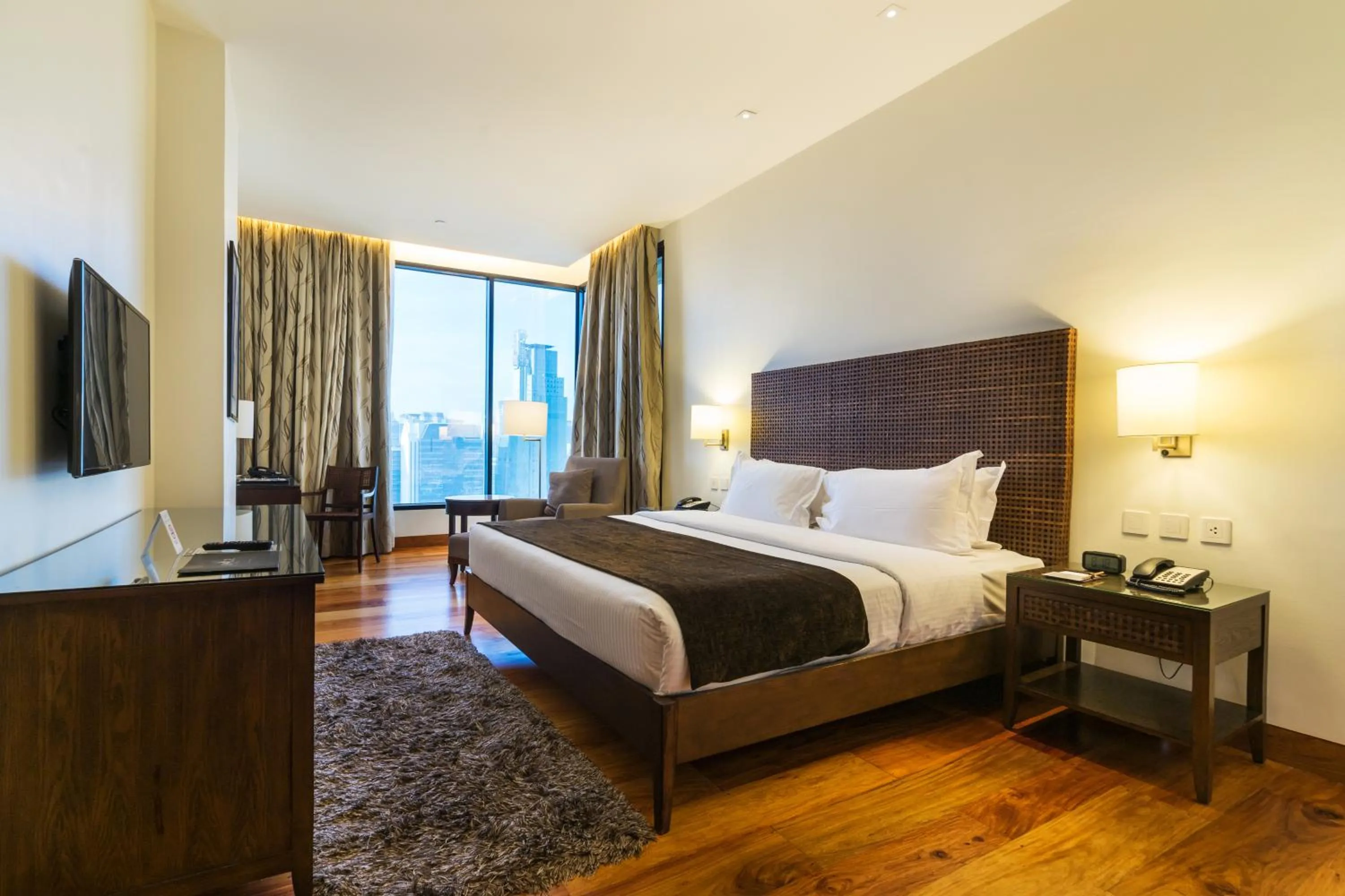 Bed in City Garden Grand Hotel