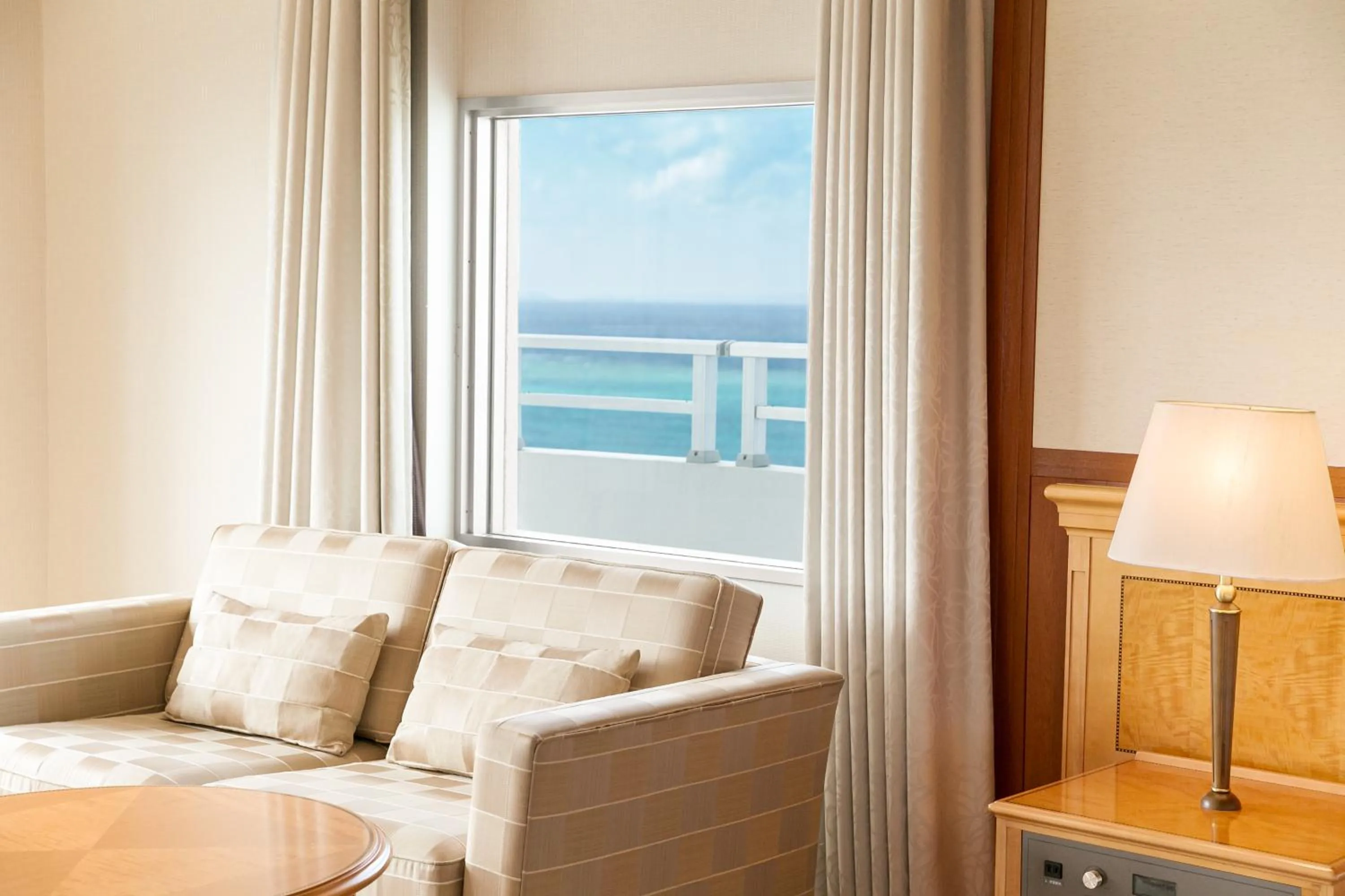 Photo of the whole room, Seating Area in Okinawa Zanpamisaki Royal Hotel