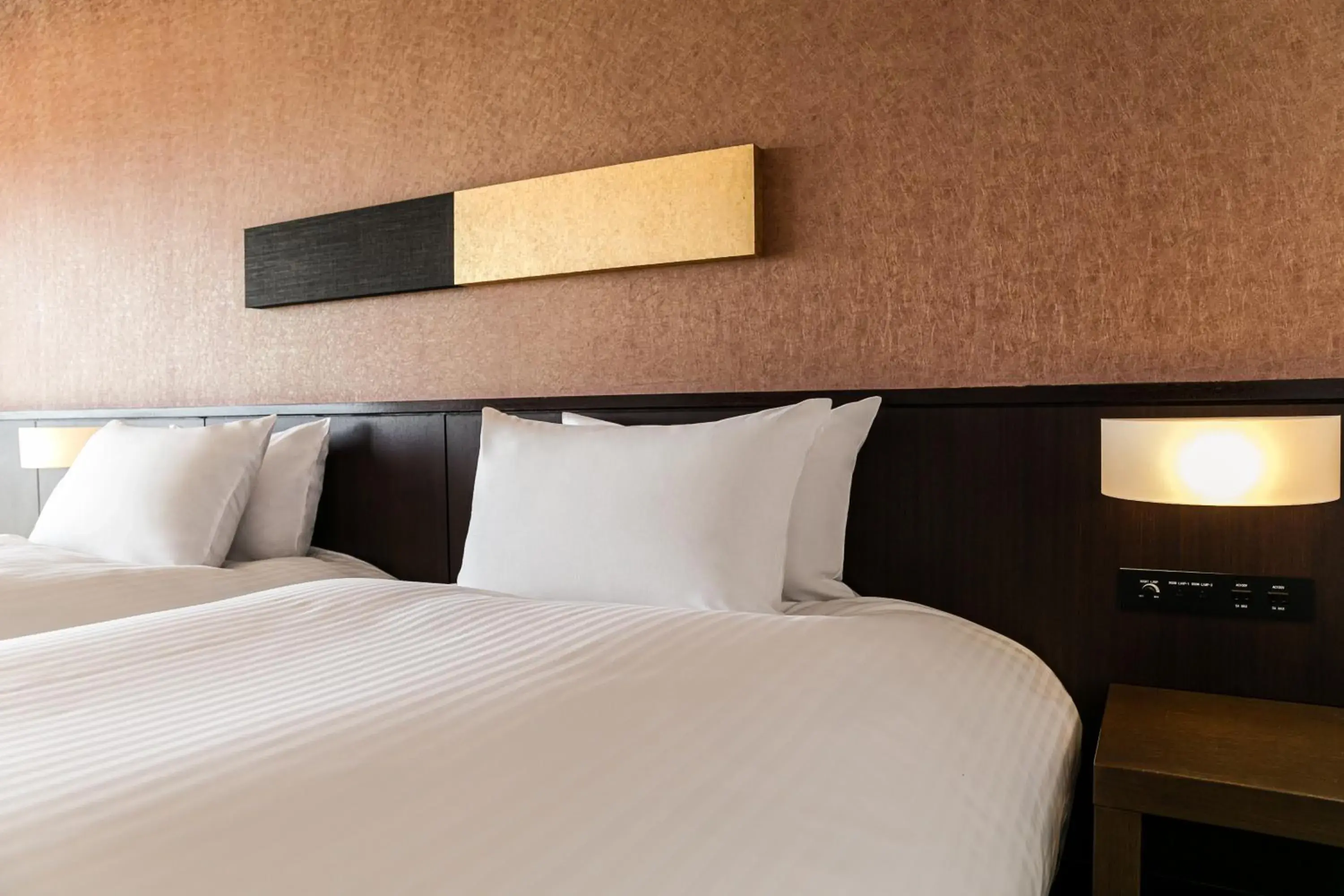 Bed in Grand Mercure Okinawa Cape Zanpa Resort Bed in Grand Mercure Okinawa Cape Zanpa Resort