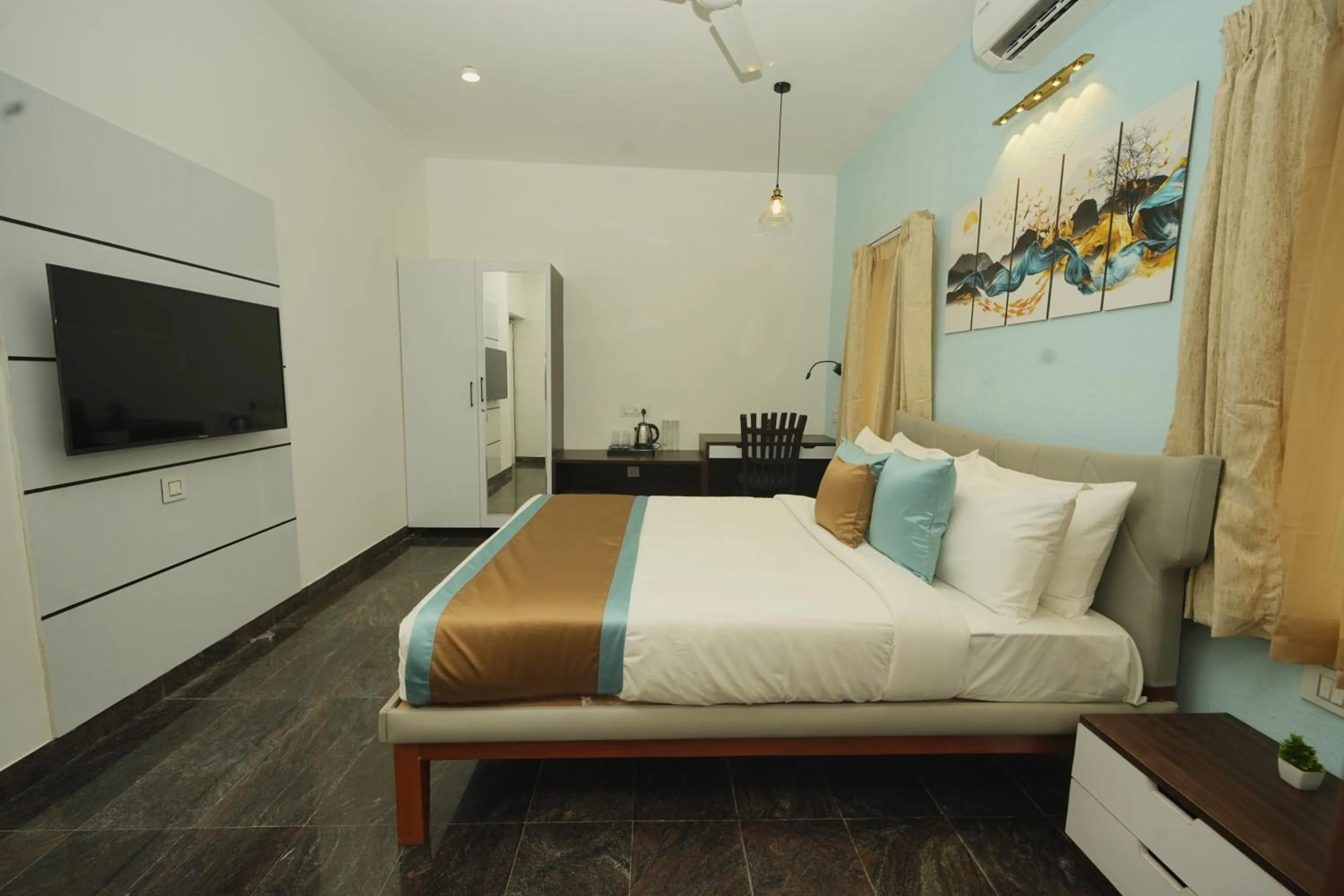 Bed in Bay Breeze Suites