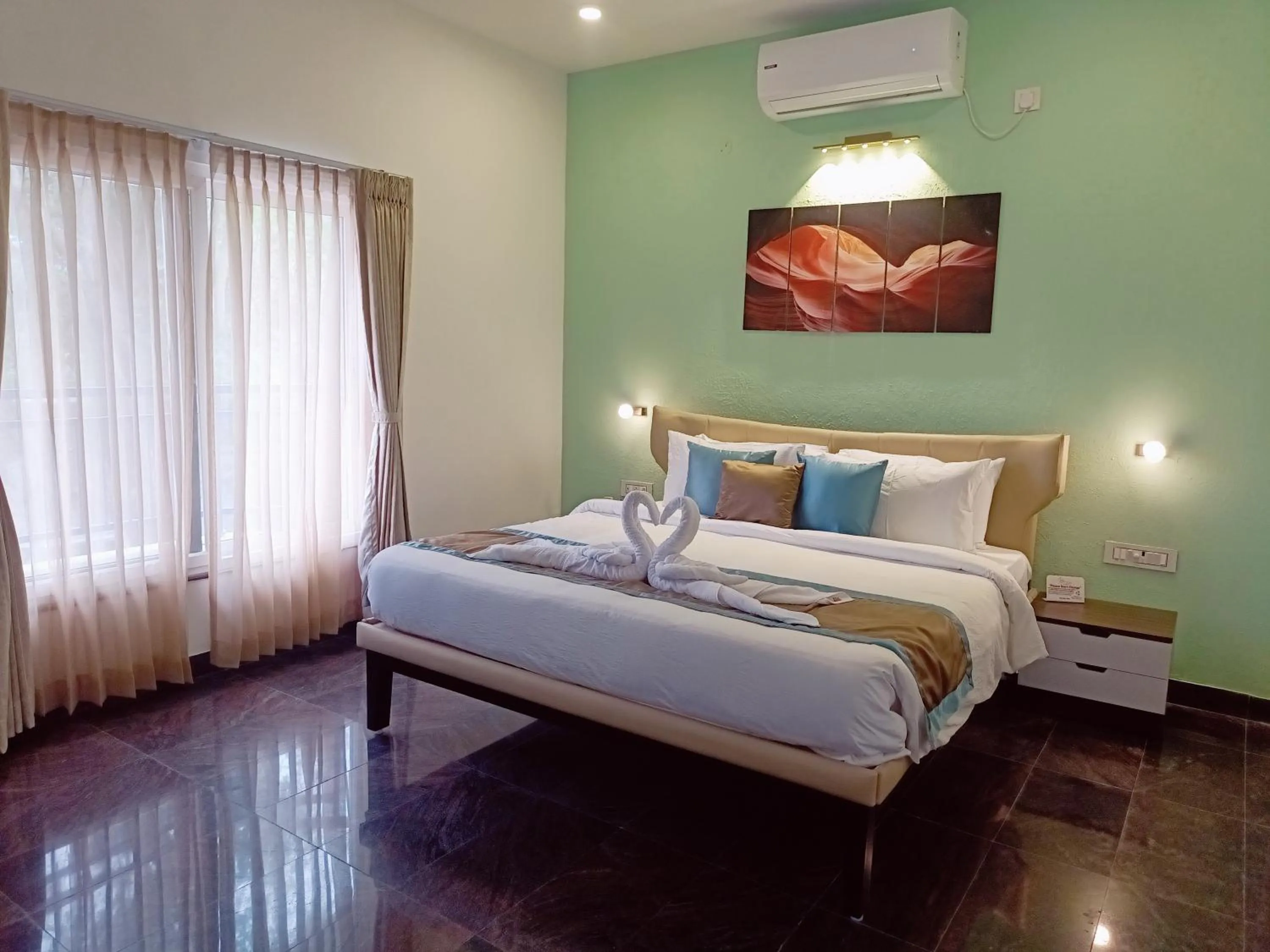 Bed in Bay Breeze Suites