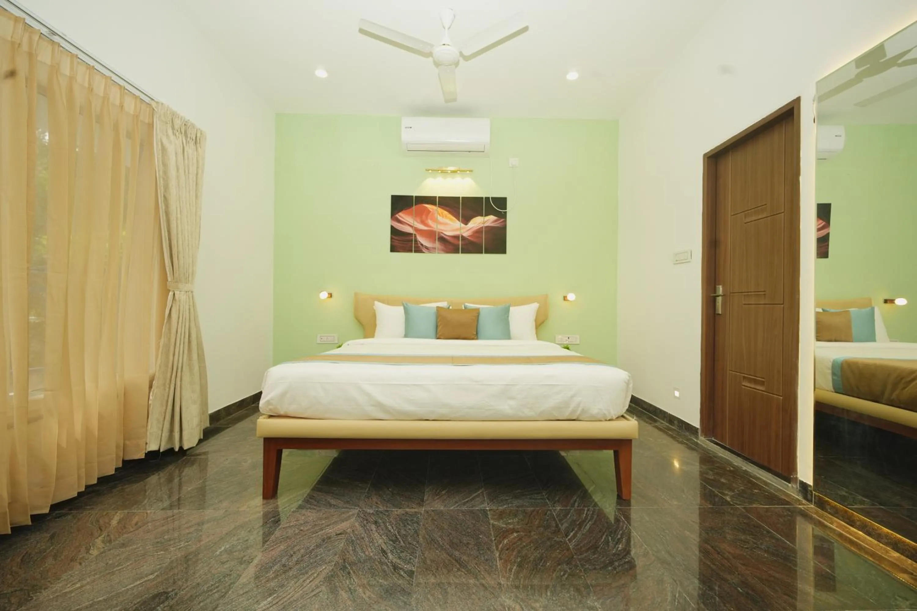 Bed in Bay Breeze Suites