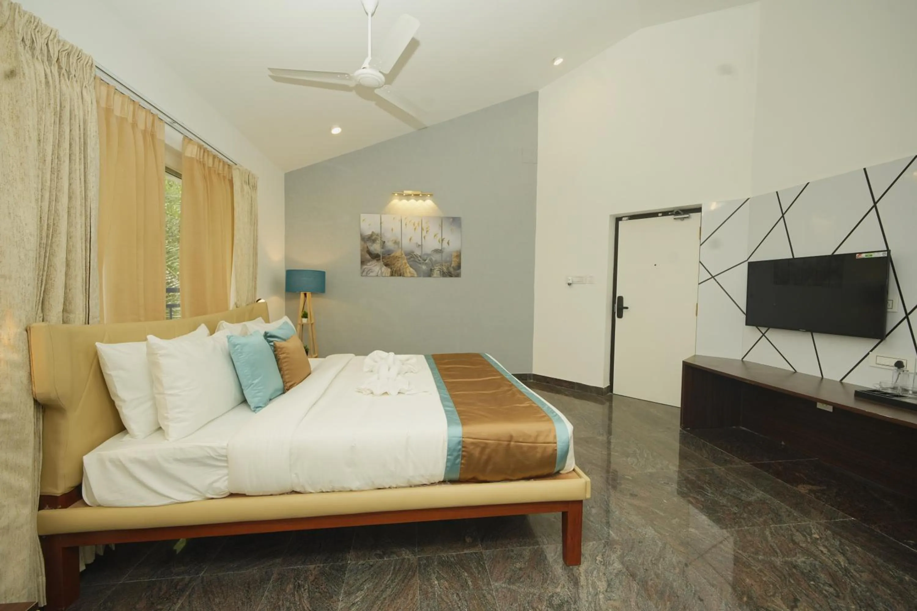 Bed in Bay Breeze Suites