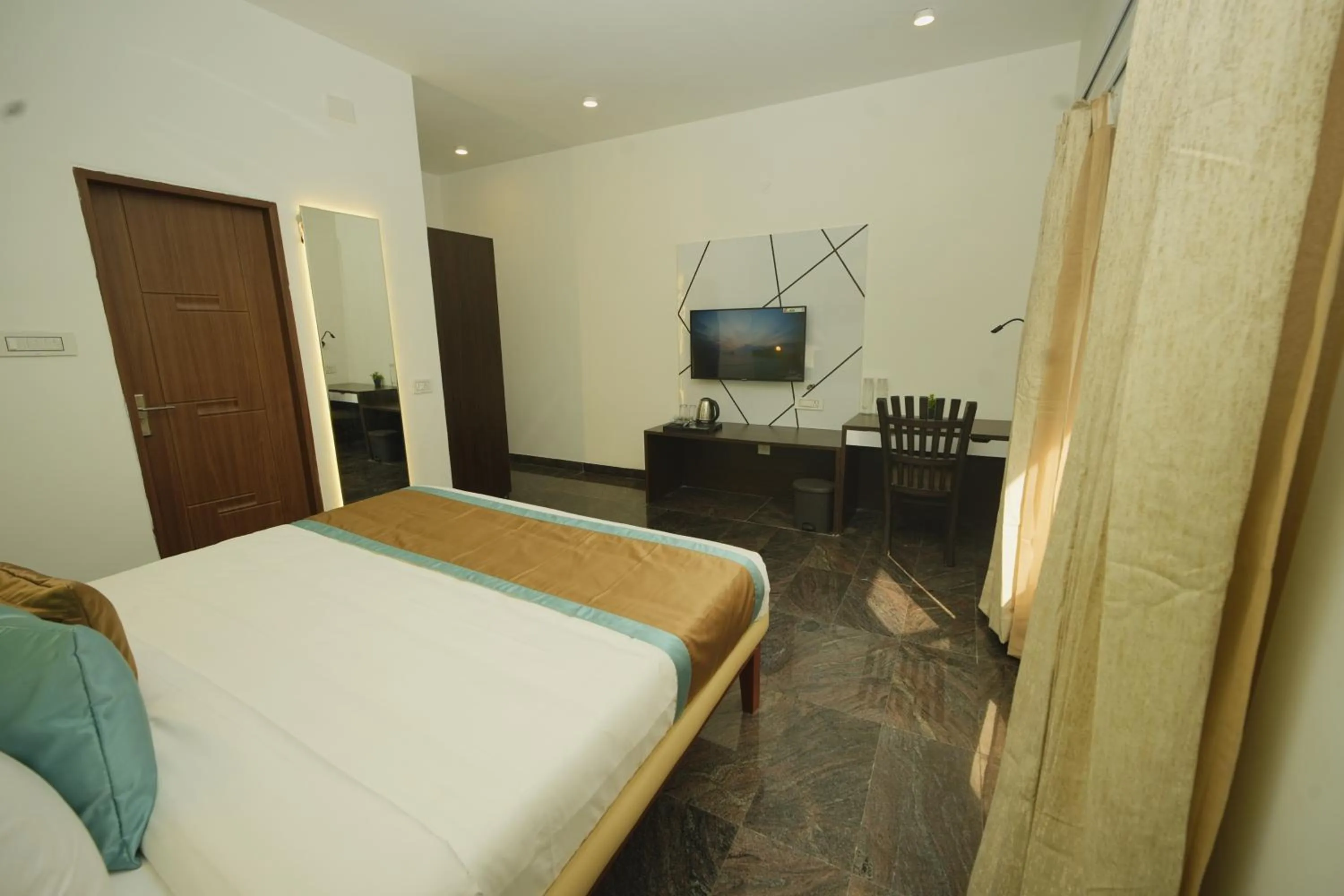 Bed in Bay Breeze Suites